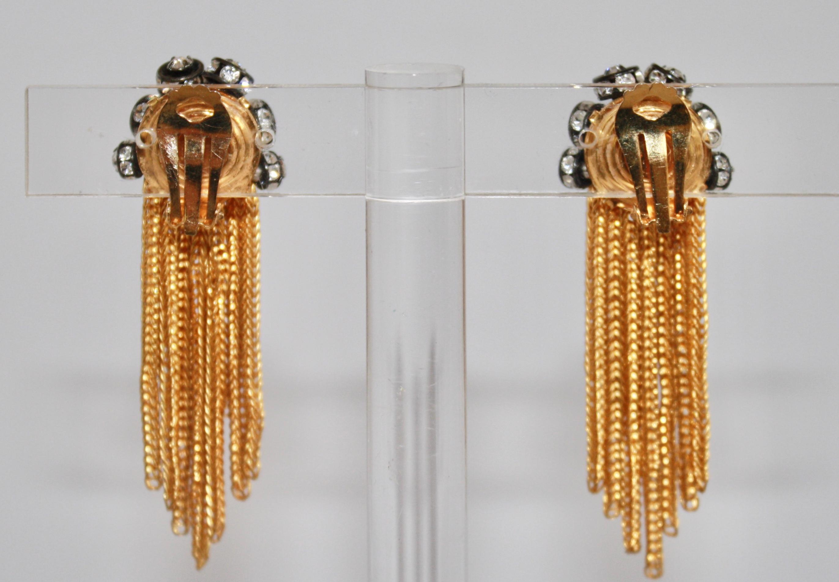 Graduated gold fringe earrings with Swarovski crystal elements adorning the top from French designer Francoise Montague. 