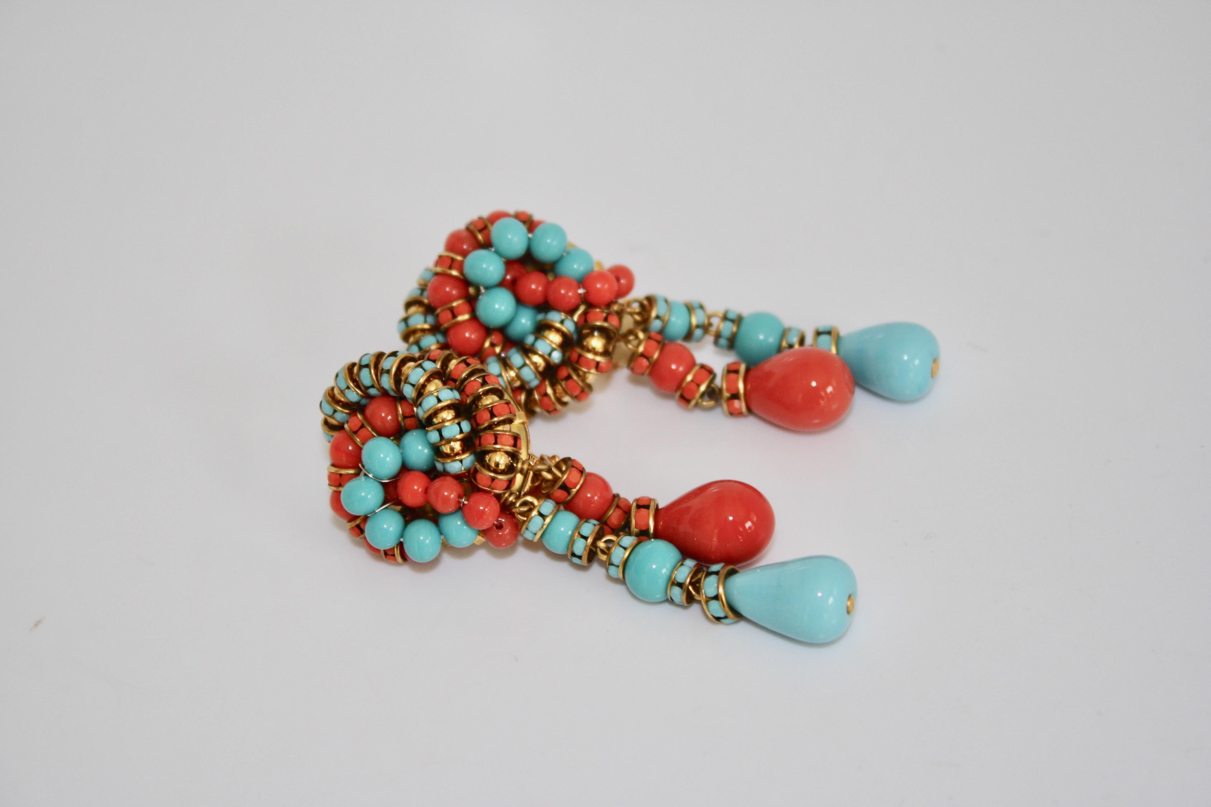 Knot and double drop clip earrings in turquoise and orange glass from Francoise Montague. 
