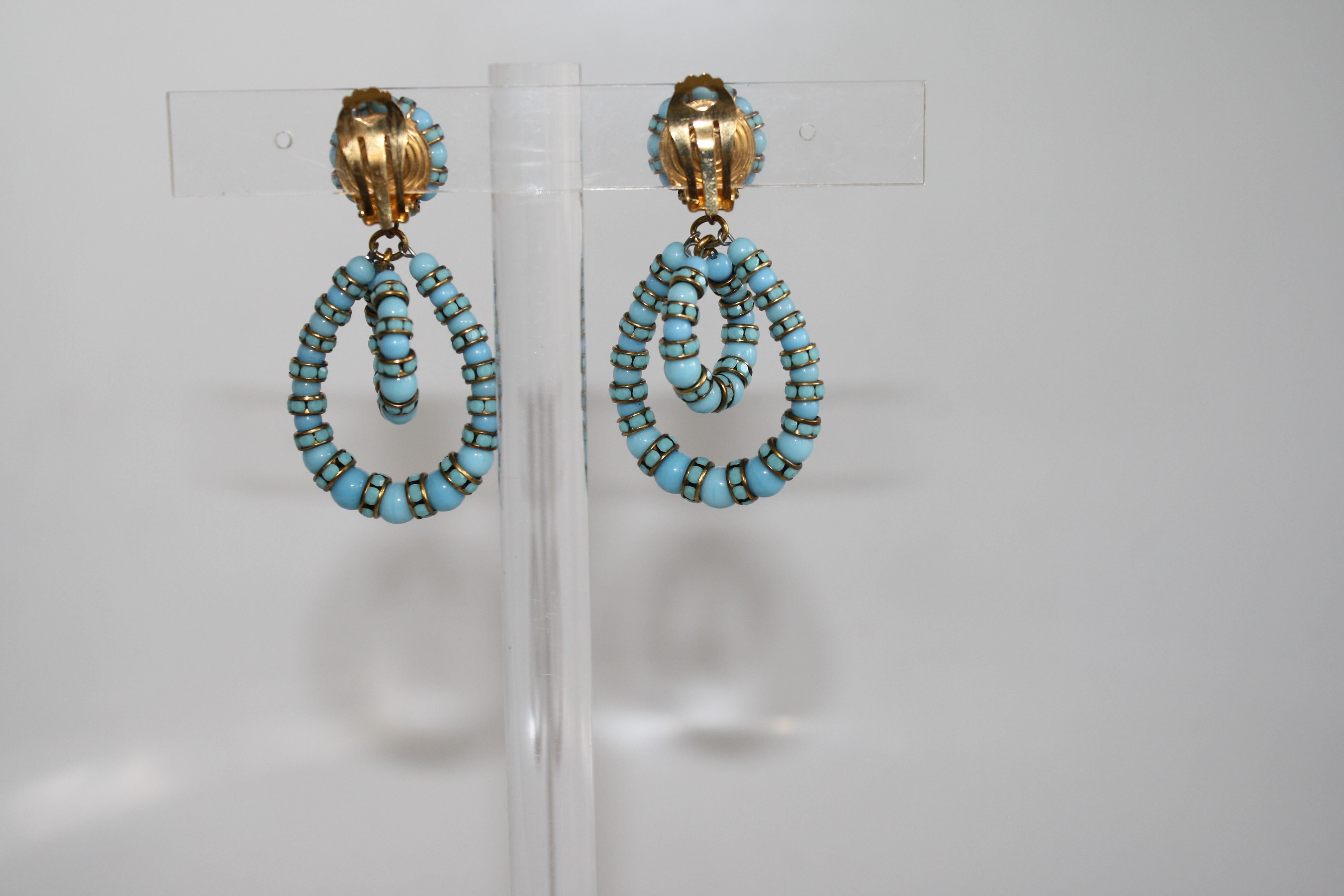 The iconic style from designer Francoise Montague in a modern turquoise hue. Made with Swarovski Crystal rondelles. 
