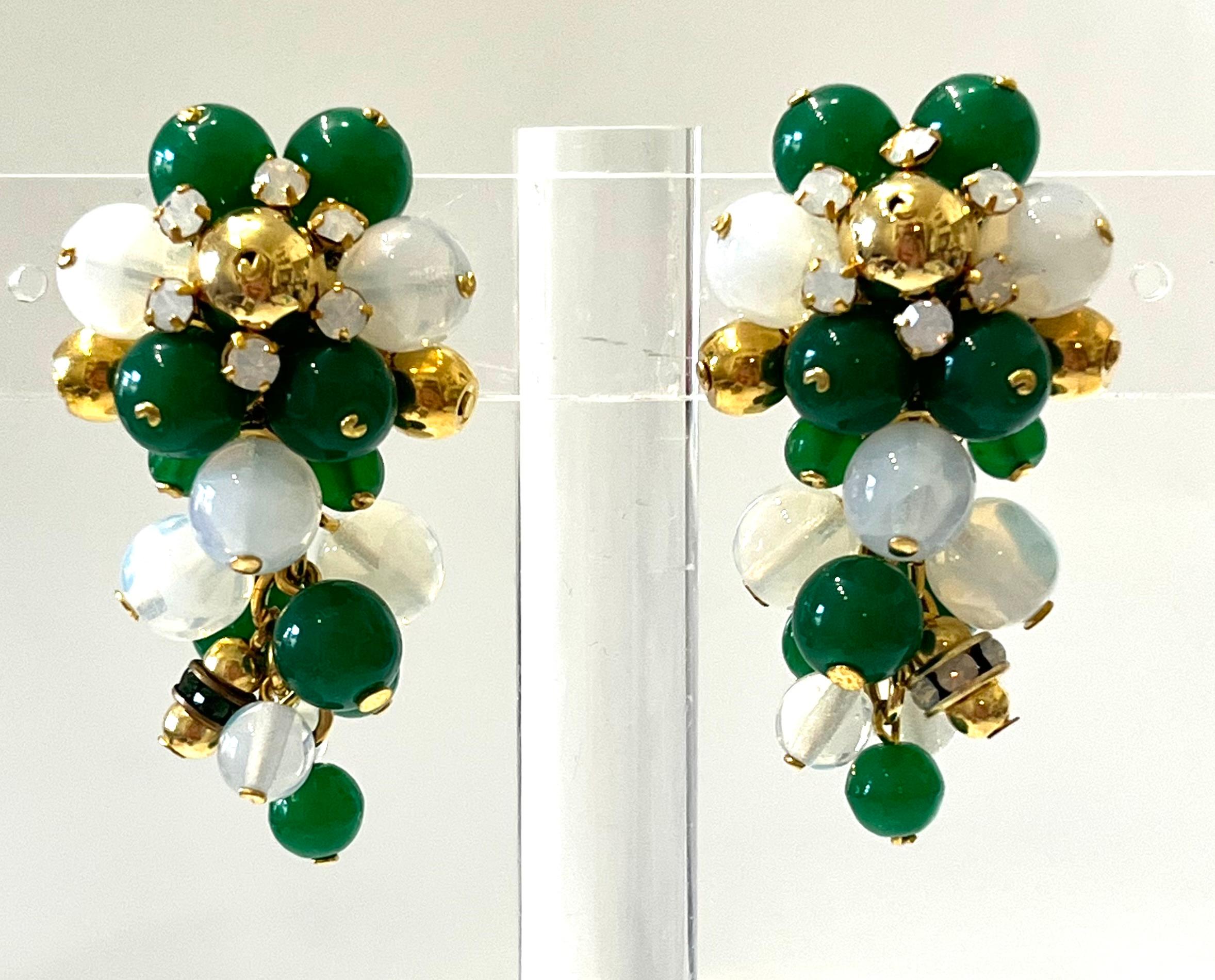 A custom piece for Isabelle K Jewelry.Handmade glass cabochons and pearls in alabaster, emerald green and gold. A fabulous statement piece to wear for the holidays and all year round!
2 “ extension chain .
Francoise Montague took over the De Saurma