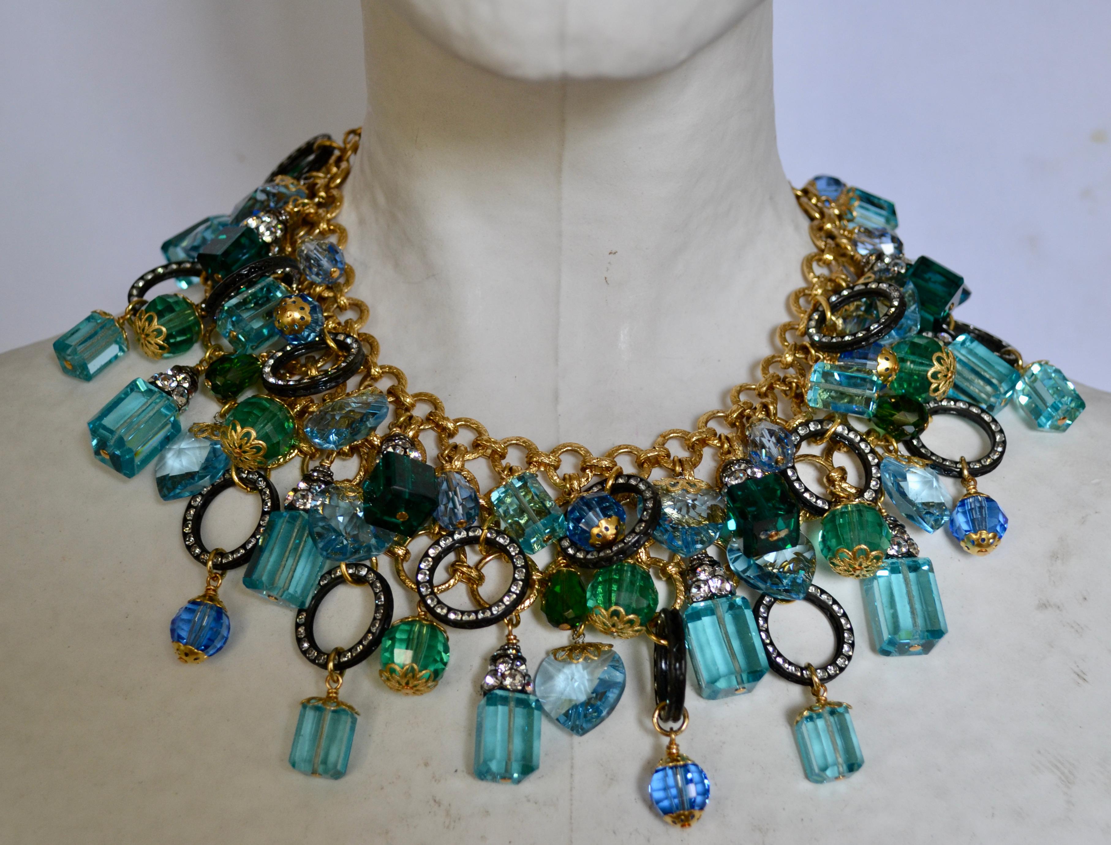 Beautiful shades of aquas and green reminiscent of the Caribbean Ocean with brass plated gold chain and Swarovski crystals make this unique creation a must have for the season.                                
2.5