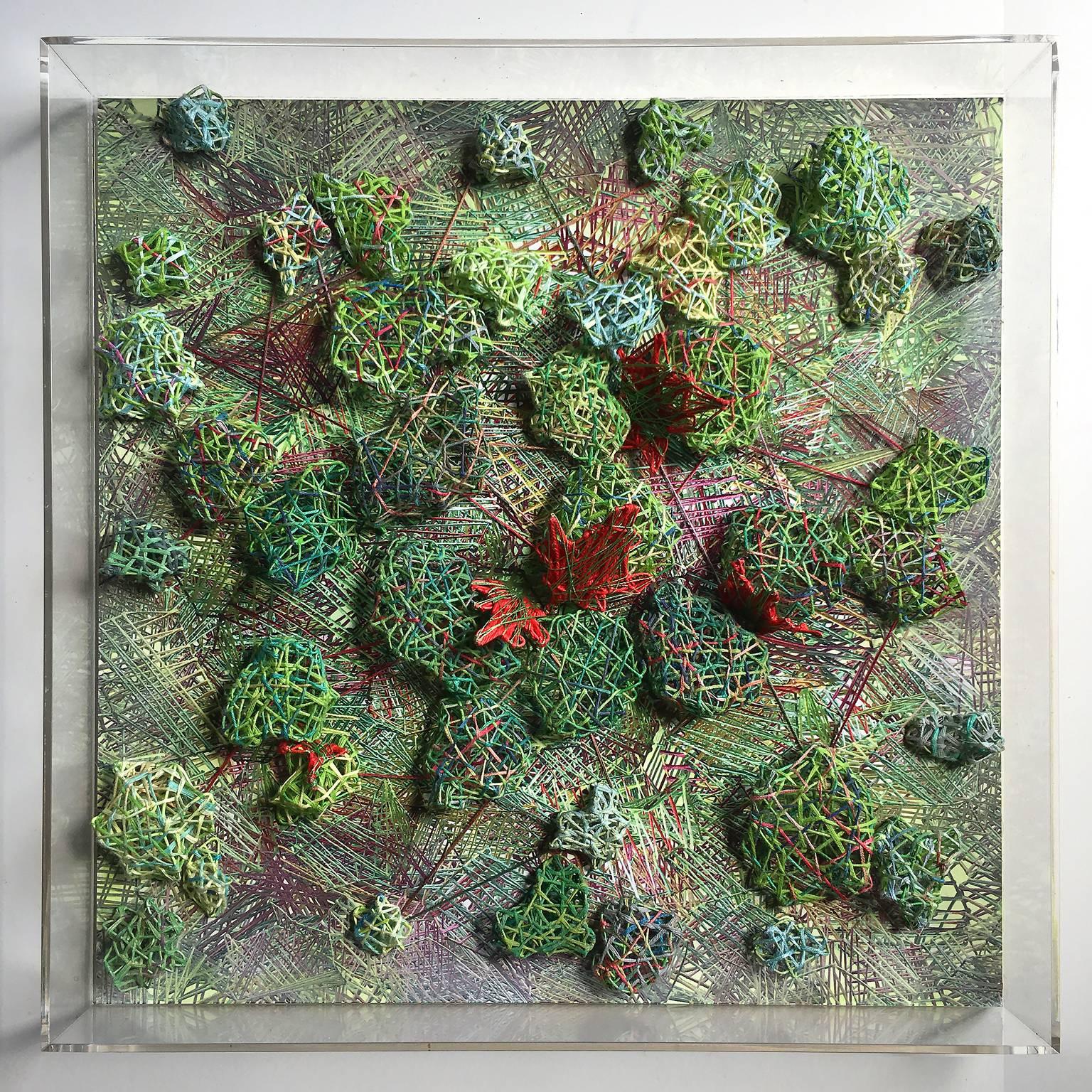 Textile composition from the series Vegetable Choreographies made with Metal structure embroidered with cotton wire and embroidered textile dominating tones of green, bright red sparkles and broken colors contrast.
Presented in a 5 faces Altuglass