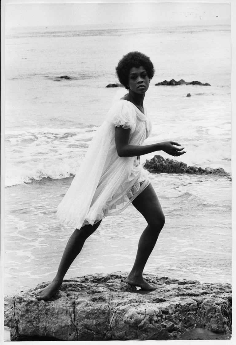 Frank D. Dandridge Black and White Photograph - Lola Falana posing on the beach photographed by Frank Dandridge, 1969.