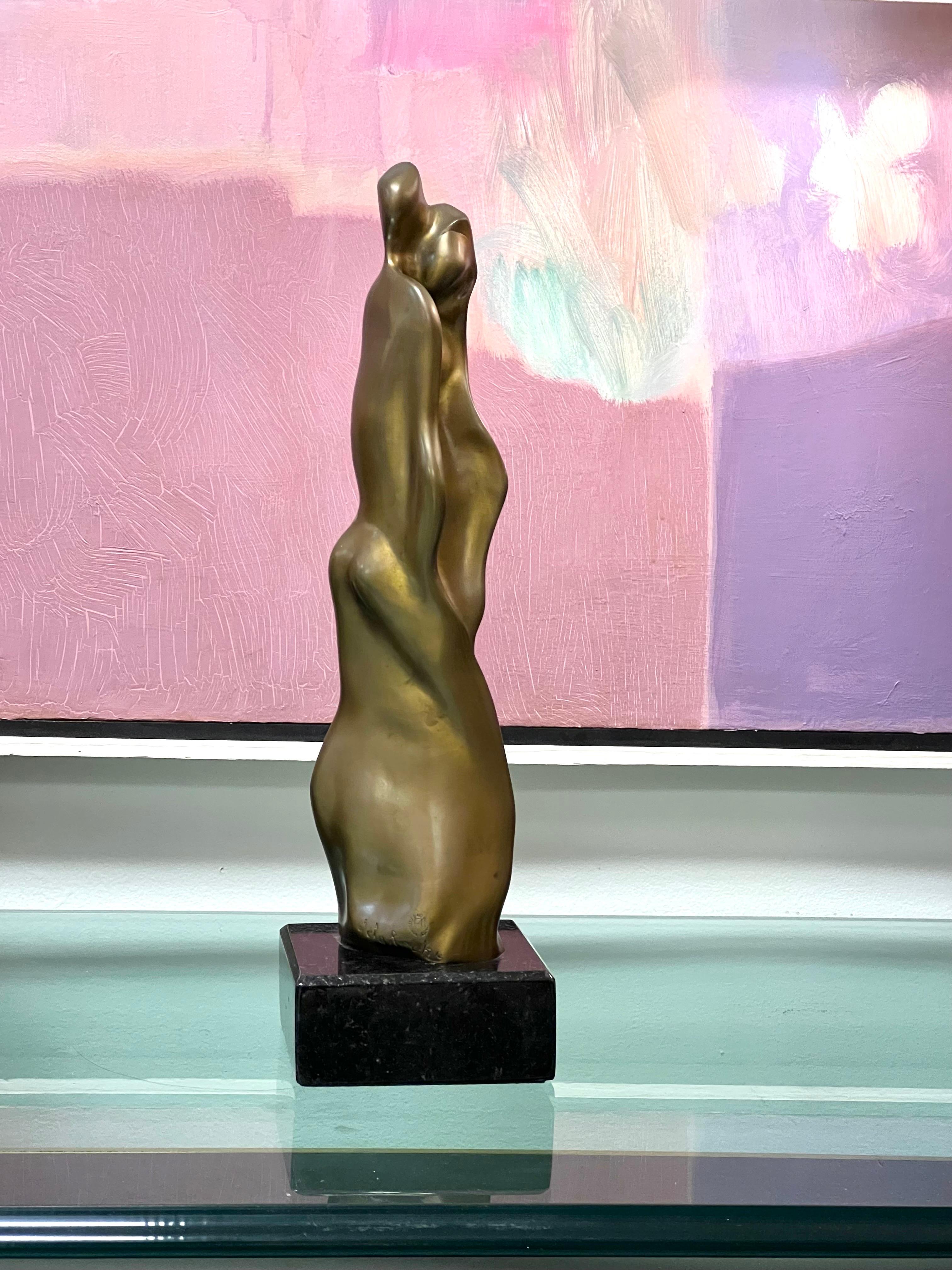Abstract realism bronze sculpture by Canadian artist Frank De La Roche. Striking from any angle. Base is black granite.