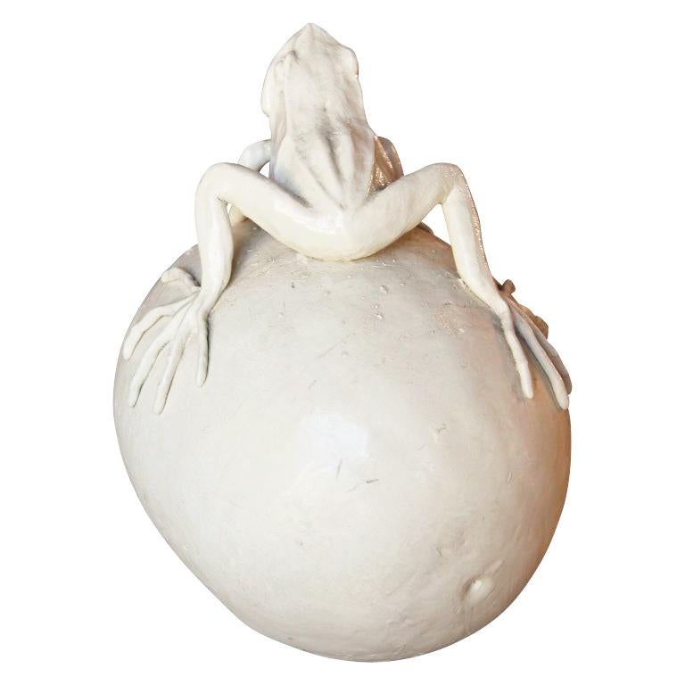 Naturalistic white porcelain sculpture of a frog sitting on a watermelon. The work features meticulously rendered natural wildlife, a key staple of Flemings body of work. Signed by the artist in the clay by the frog's foot. Other works by Frank