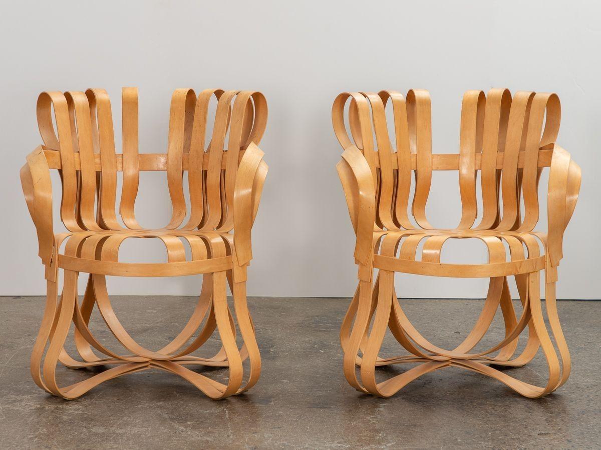 Pair of Cross Check Armchairs, designed by Frank Gehry for Knoll. A dynamic design that debuted as a part of the architect’s innovative collection exploring form and function at MoMA. Constructed from laminated maple wood that is bent, woven and