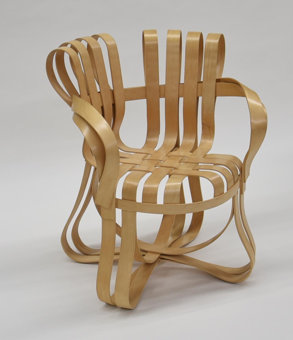 Frank O. Gehry for Knoll. 'Cross Check Chair'.
Designed in 1990-1992. Bent maple wood band construction, woven into each other.
Marked under the seat. Produced by Knoll International, no longer in production.  

One of the most celebrated