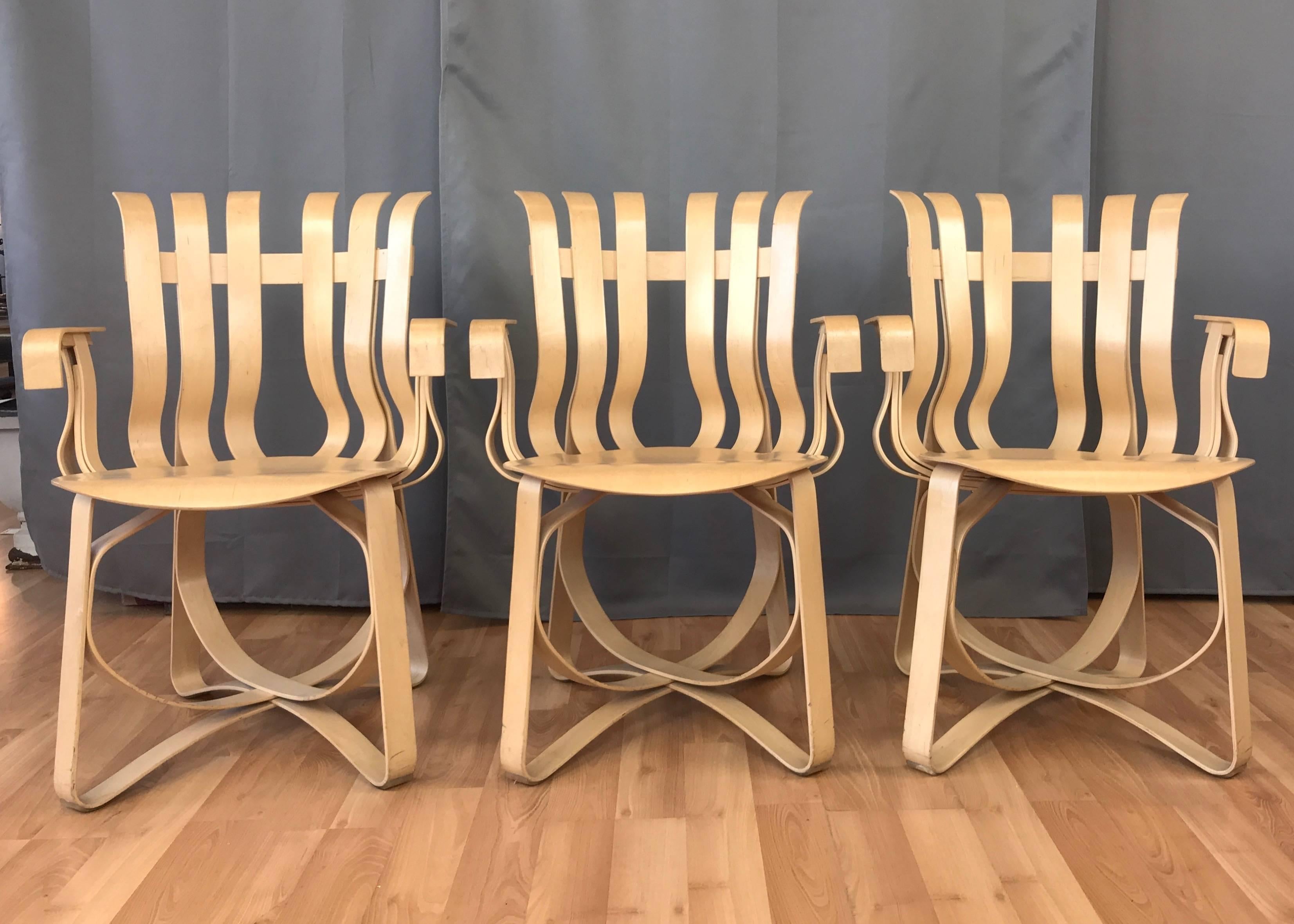 Three fantastic 1999–2000 examples of Frank O. Gehry’s hat trick chairs for Knoll that were designed in 1990, offered individually.

Though named with a nod to hockey by the Pritzker Prize-winning Canadian-born architect and designer, this singular