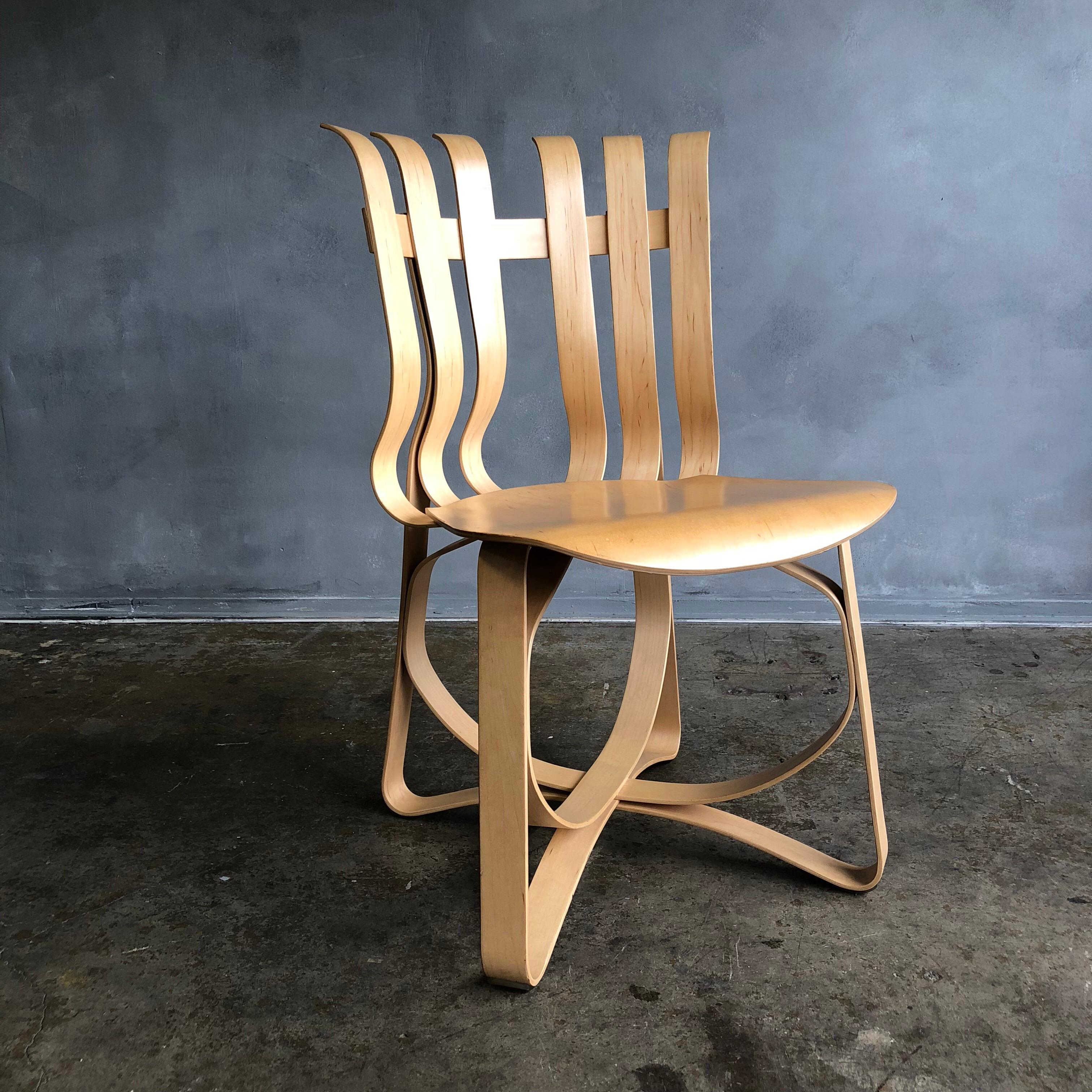 Inspired by the strength of apple crates Frank Gehry designed this uniquely beautiful maple wood chair. While this chair looks fragile it is deceptively strong and sturdy.