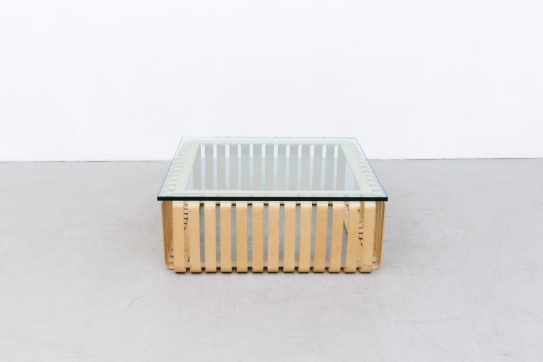 Handsome Frank Gehry 'Icing' coffee table for Knoll. Made with bent strips of natural maple with plate glass top. In original condition with some wear and scratching consistent with age and use.