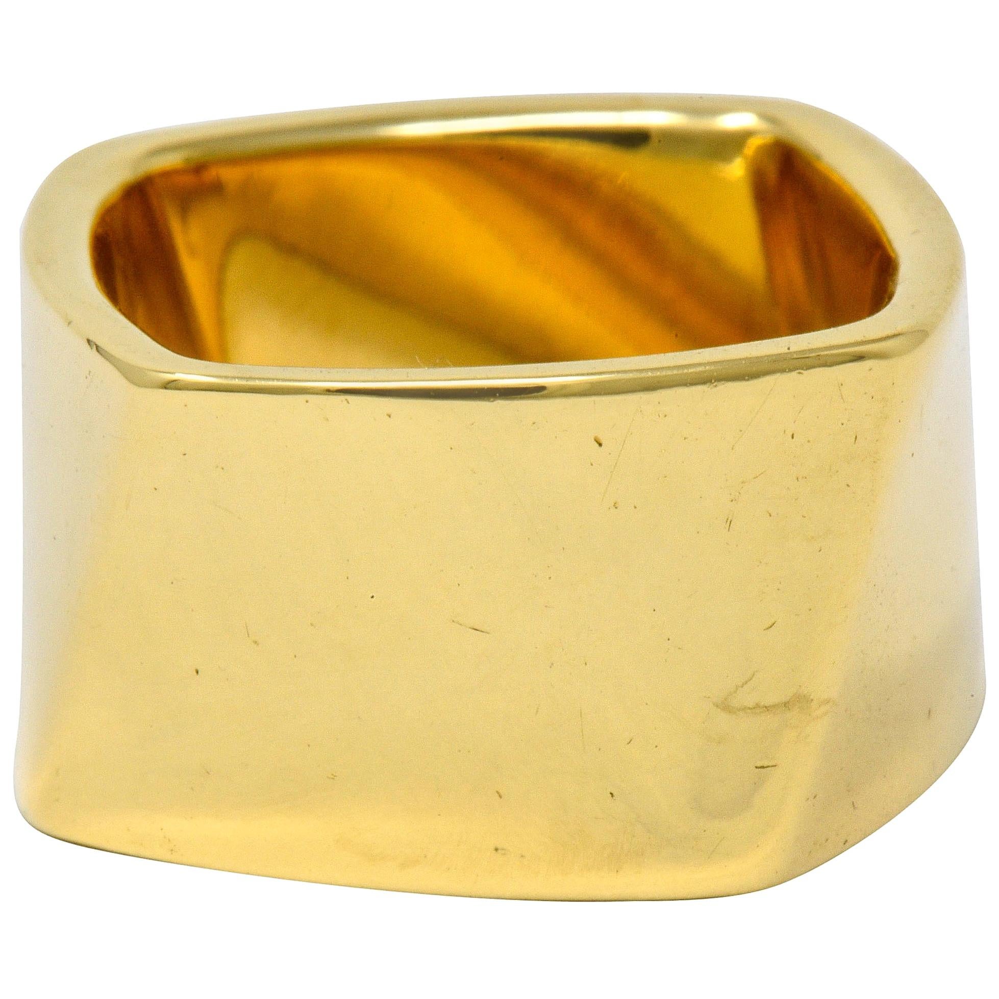 Stylized wide band ring that features a cushion shaped profile

Slightly twisted sides create four dynamic and brightly polished surfaces

Signed T & Co. Gehry

Stamped 750 for 18 karat gold

Circa: 2006

Ring Size: 6 3/4 & not sizable

Measures:
