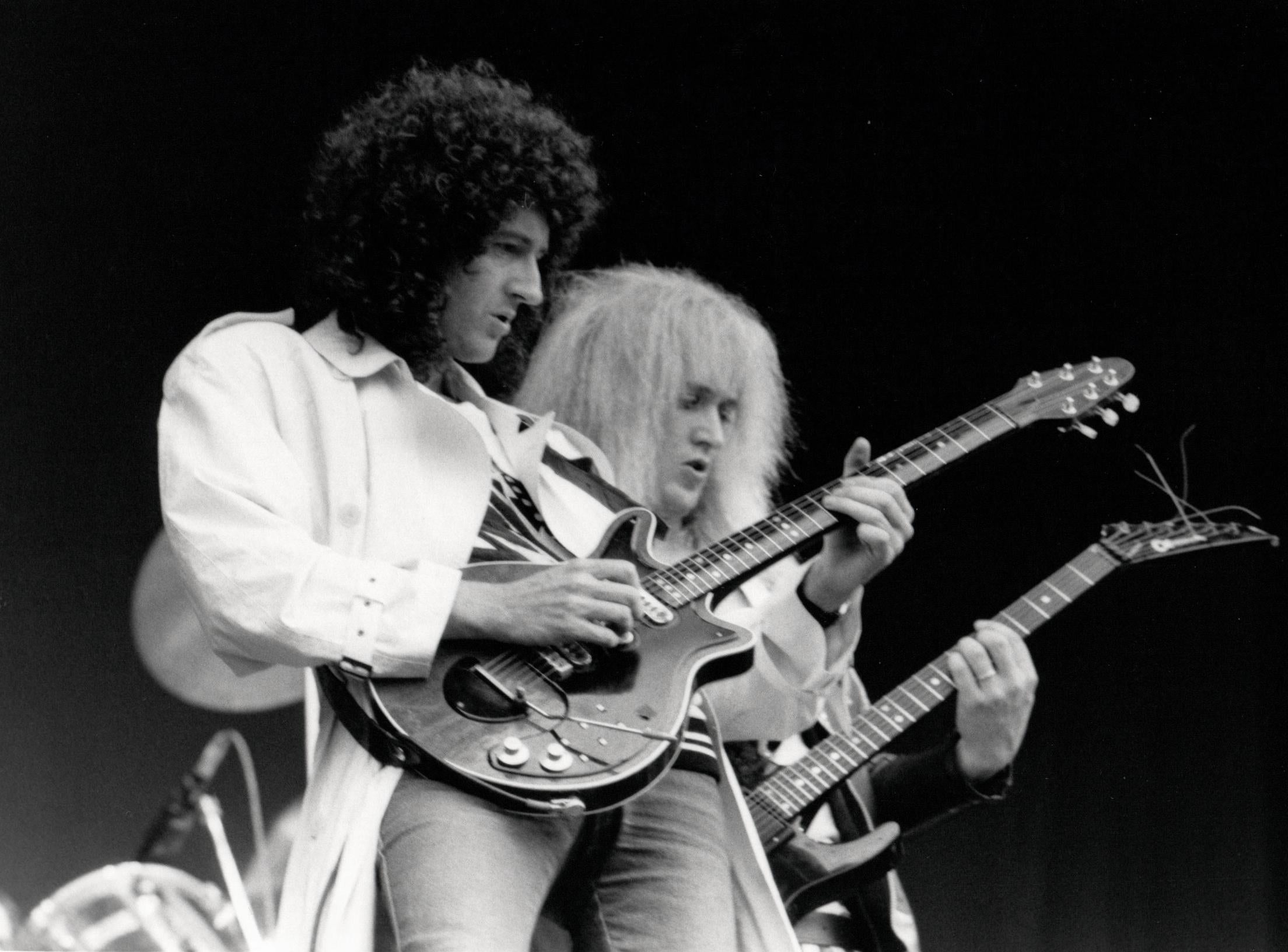 Frank Griffin Black and White Photograph - Brian May and Bad News Rocking Out on Stage Vintage Original Photograph