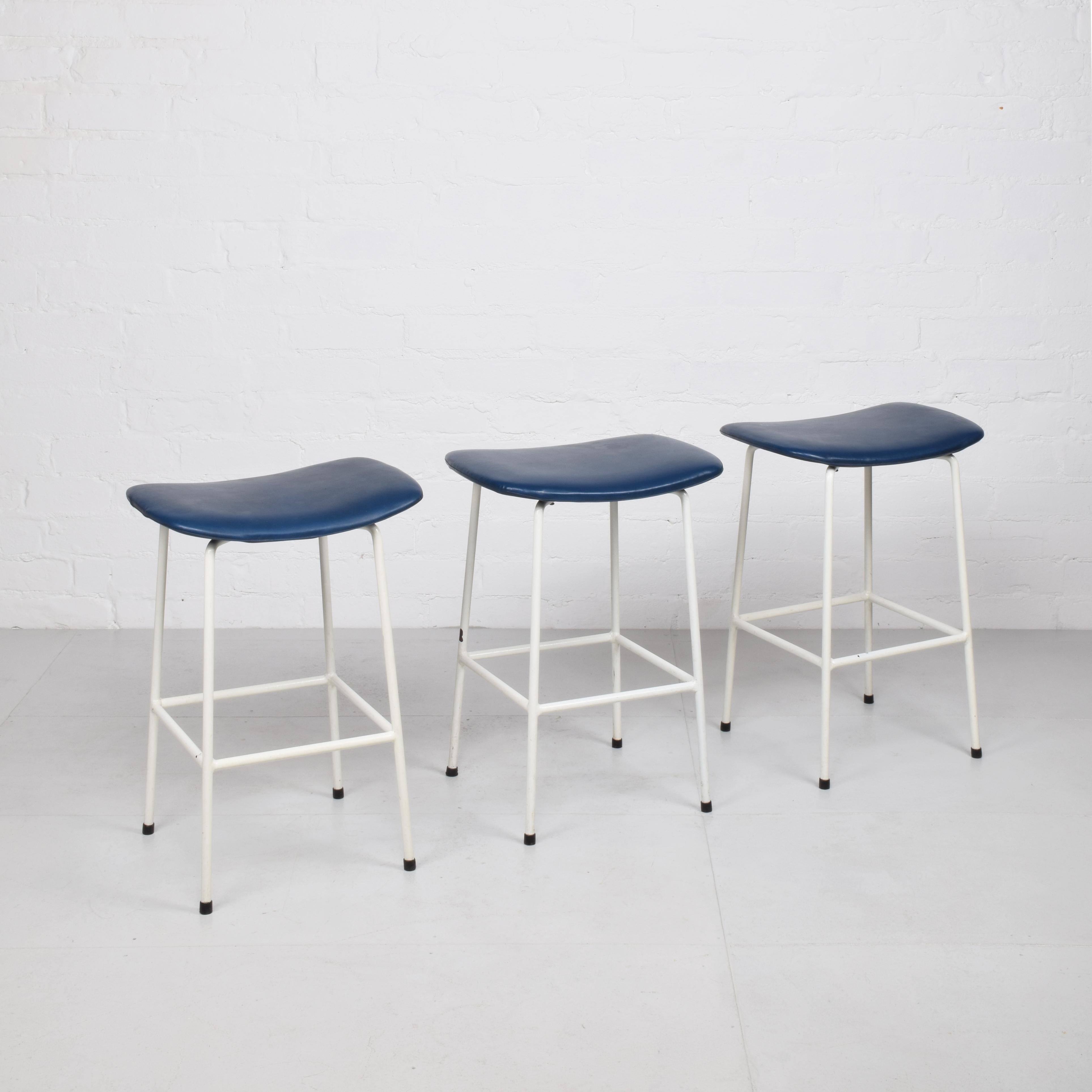 Frank Guille for Kandya
Set of 3 ‘Program’ stools, 1958
(Low version, 51 cm seat height)
 
White powder coated steel frames, vinyl upholstery on moulded plywood seats. Labels to undersides.
 
Good original condition. Some small areas of