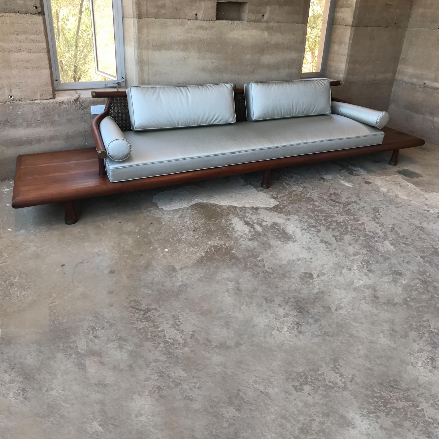 1950s Sensational mahogany sofa designed by Frank Kyle Mexico City
Asian inspired design. Mexico modernism at its finest. 
Mahogany wood, bronze, cane and upholstered cushions.
Built-in side tables. Low profile with amazing clean modern lines.