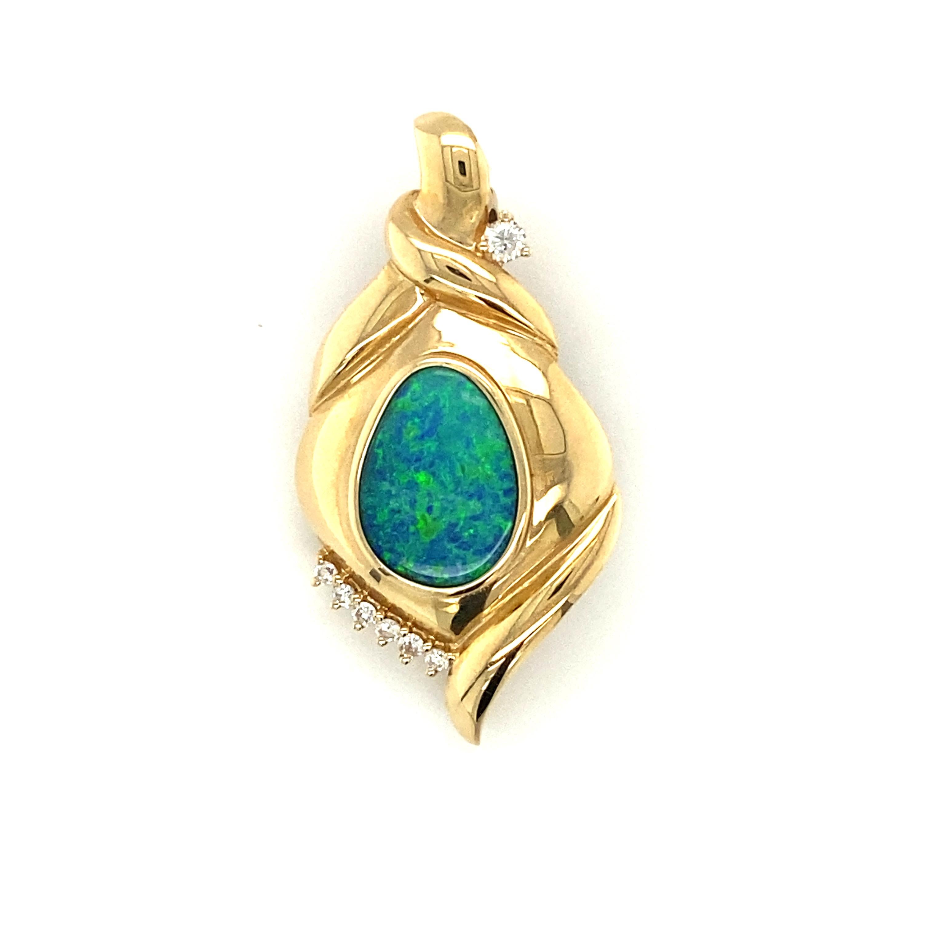 Item Details: This freeform design pendant made by artist Frank Lau features a center Australian Opal of 2.44 carats, with round accent diamonds. This is signed by the artist.

Circa: 2000s
Metal Type: 14k yellow gold
Weight: 7.4 grams
Size: 1.5