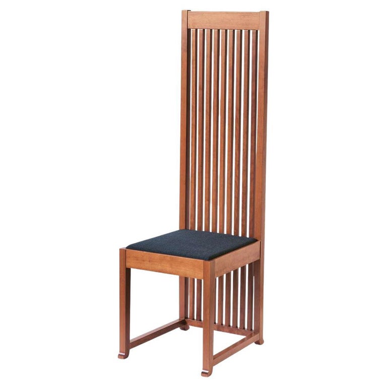 Black Robie chair designed by Frank Lloyd Wrigh in 1908, relaunched in 1986.

Manufactured by Cassina in Italy.

The rigorous design of this chair is a perfect exemplar of Frank Lloyd Wright’s design ethos. This can be seen in the tall backs and