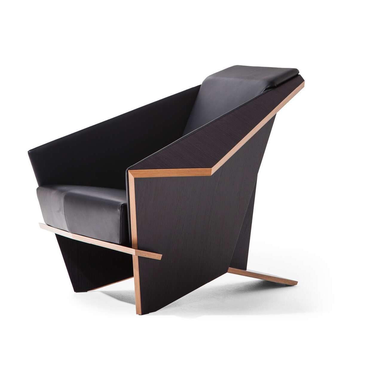 Armchair designed by Frank Lloyd Wrigh circa 1949, relaunched in 1986-90.

Leather and stained black oak edition.

Manufactured by Cassina in Italy.

Origami in wood, emblematic of Frank Lloyd Wright’s design maturity and ever-surprising
