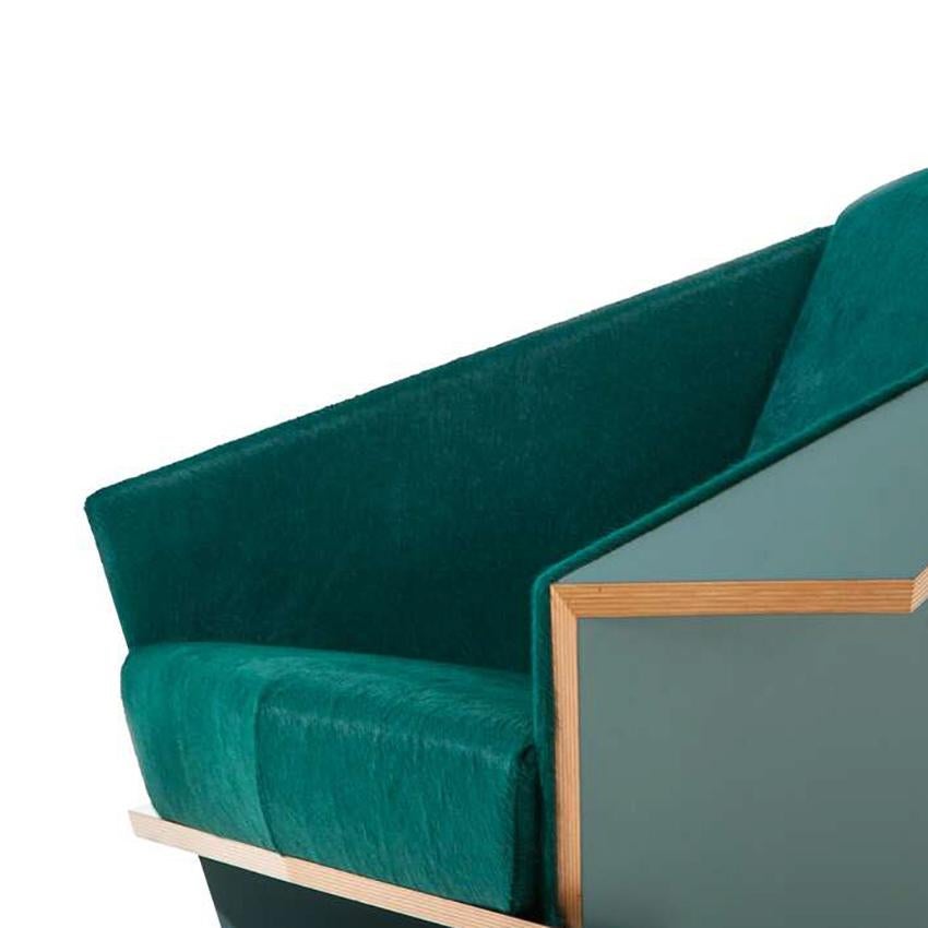 Armchair designed by Frank Lloyd Wrigh circa 1949 , relaunched in 1986-90.

Hairy skin and lacquered oak edition.

Manufactured by Cassina in Italy.

Origami in wood, emblematic of Frank Lloyd Wright’s design maturity and ever-surprising