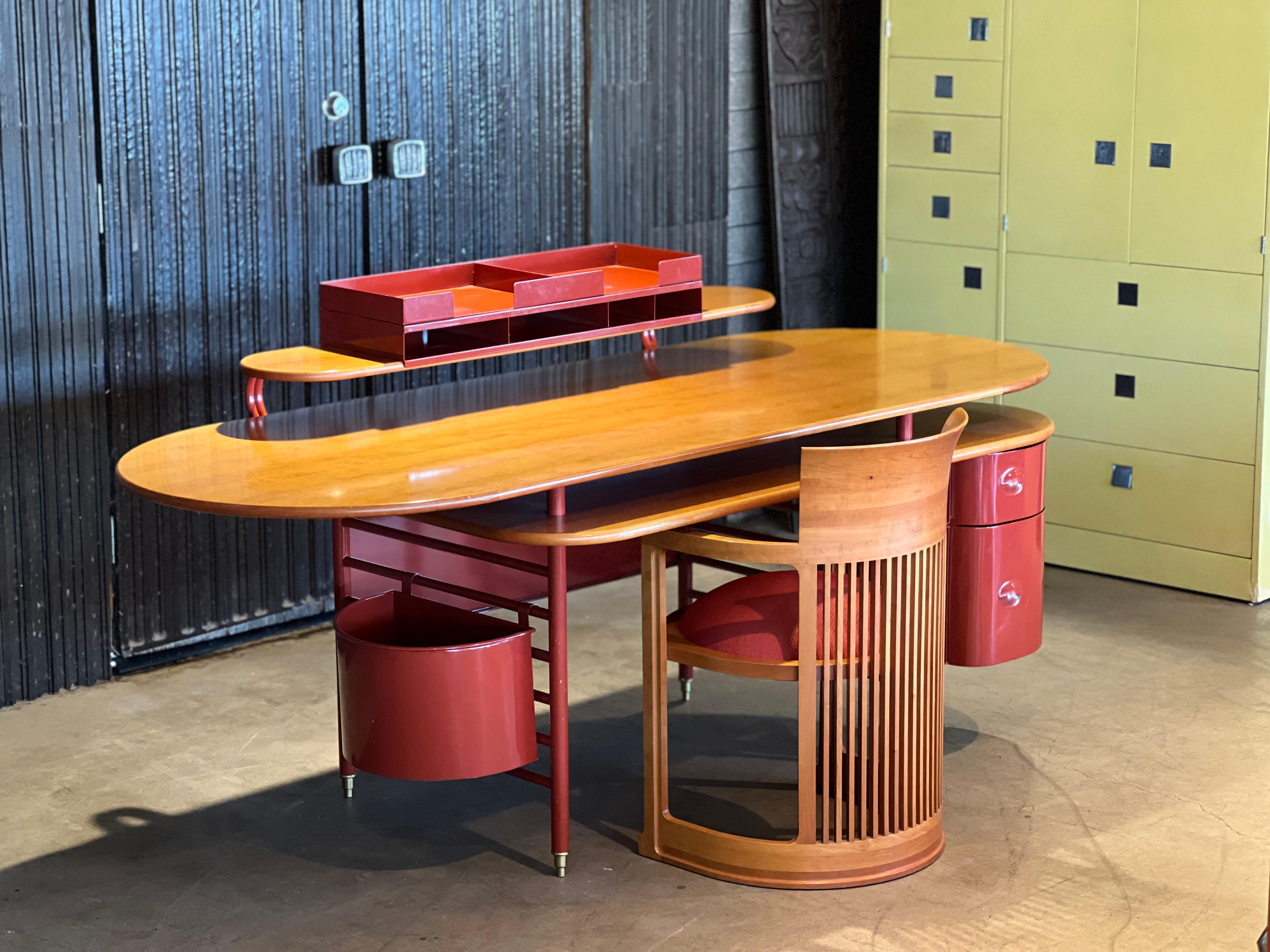 Frank Lloyd Wright for Cassina 617 desk. Originally designed in 1936 for the S.C. Johnson Wax Company in Wisconsin. This all original example dates from the late 1980s and is signed and numbered. Done in enameled steel, brass and cherry. 

Please