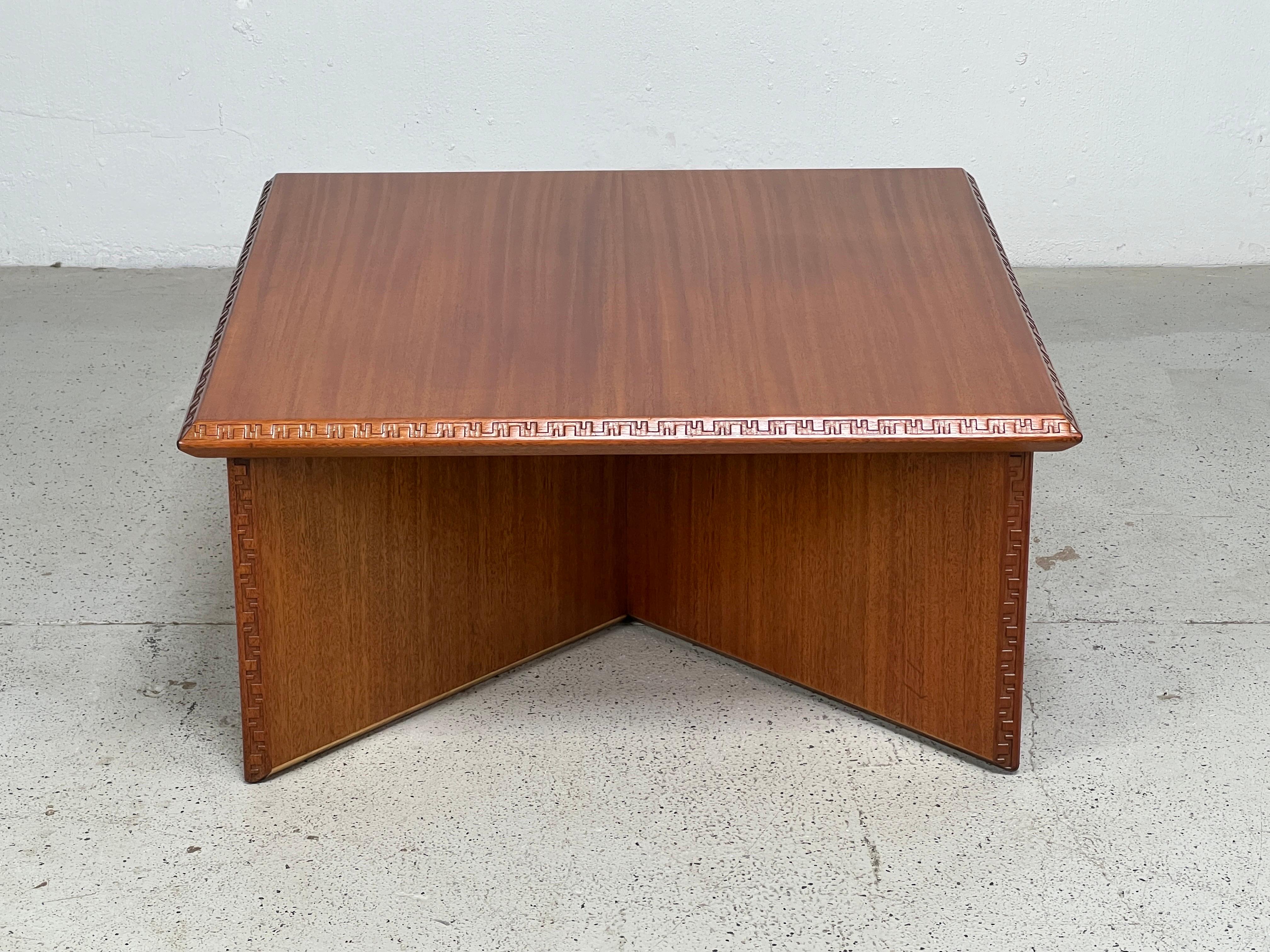 A mahogany coffee table designed by Frank Lloyd Wright for Henredon.