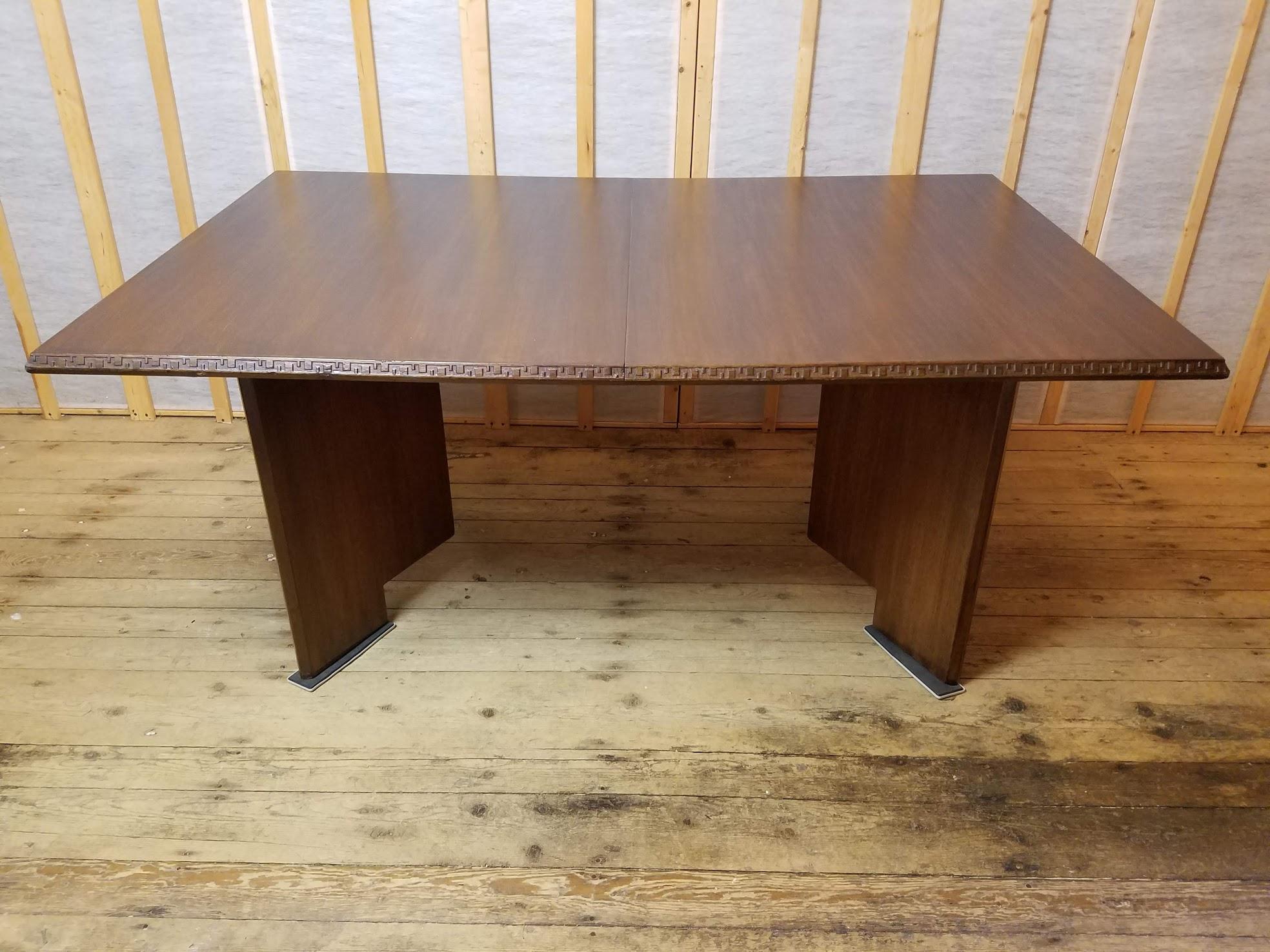 A mahogany dining table designed by Frank Lloyd Wright as part of his Taliesin line of furniture manufactured by Heritage Henredon between 1955-1959.
A very versatile table with (two) 18 inch leaves thus extending the 66 inch table to 102