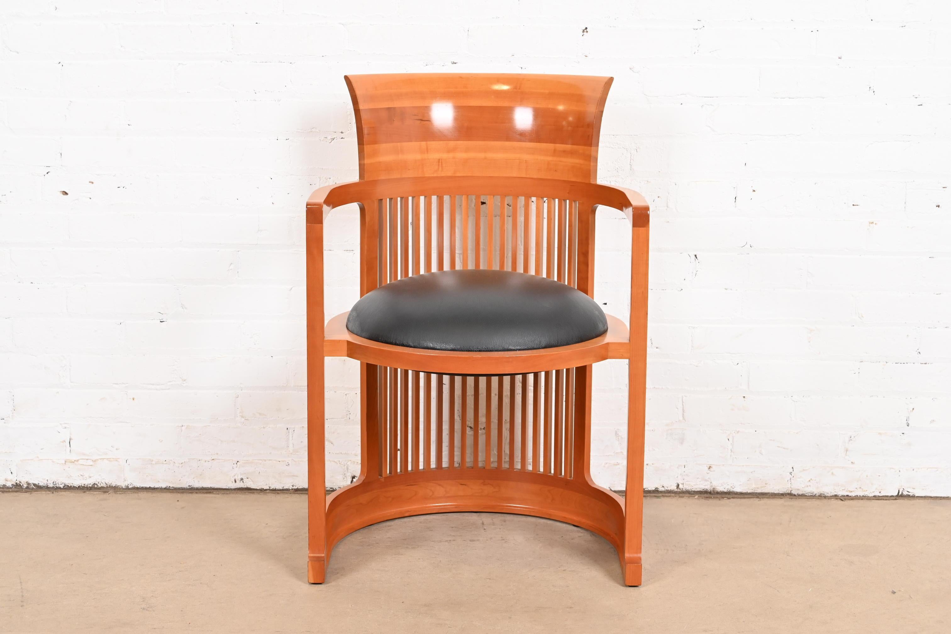 An exceptional Arts & Crafts or Prairie style barrel chair

By Frank Lloyd Wright for Cassina

Italy, 1986 (originally designed in 1903 for the Martin House in Buffalo)

Carved cherry wood, with black leather upholstered seat.

Measures: 21.38