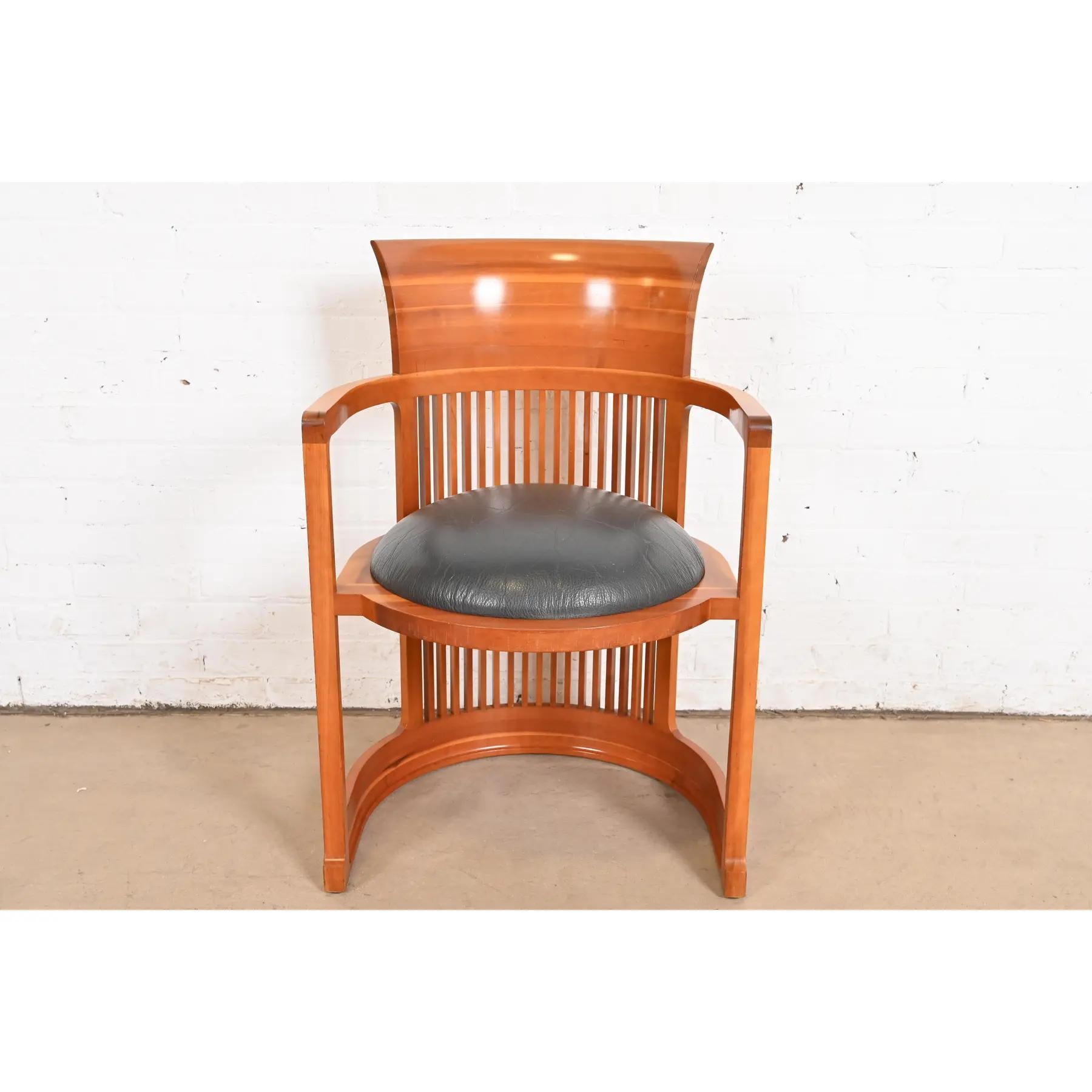 An exceptional Arts & Crafts or Prairie style barrel chair

By Frank Lloyd Wright for Cassina

Italy, 1986 (originally designed in 1903 for the Martin House in Buffalo)

Carved cherry wood, with leather upholstered seat.

Measures: 21.5