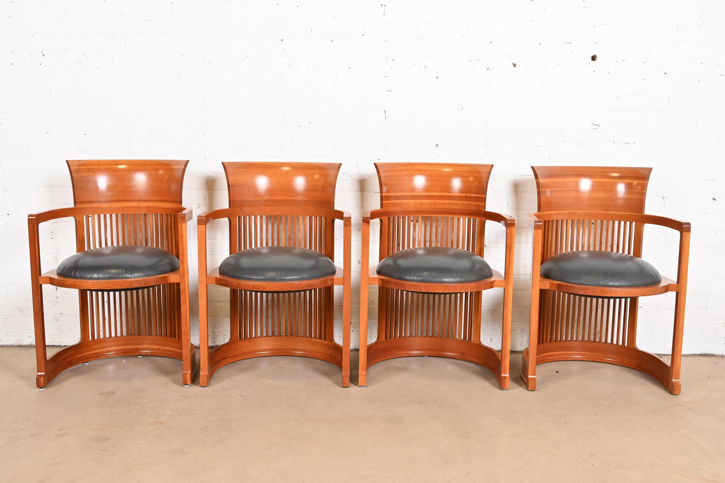 An exceptional set of four Arts & Crafts or Prairie style barrel chairs

By Frank Lloyd Wright for Cassina

Italy, 1986 (originally designed in 1903 for the Martin House in Buffalo)

Carved cherry wood, with leather upholstered seats.

Measures: