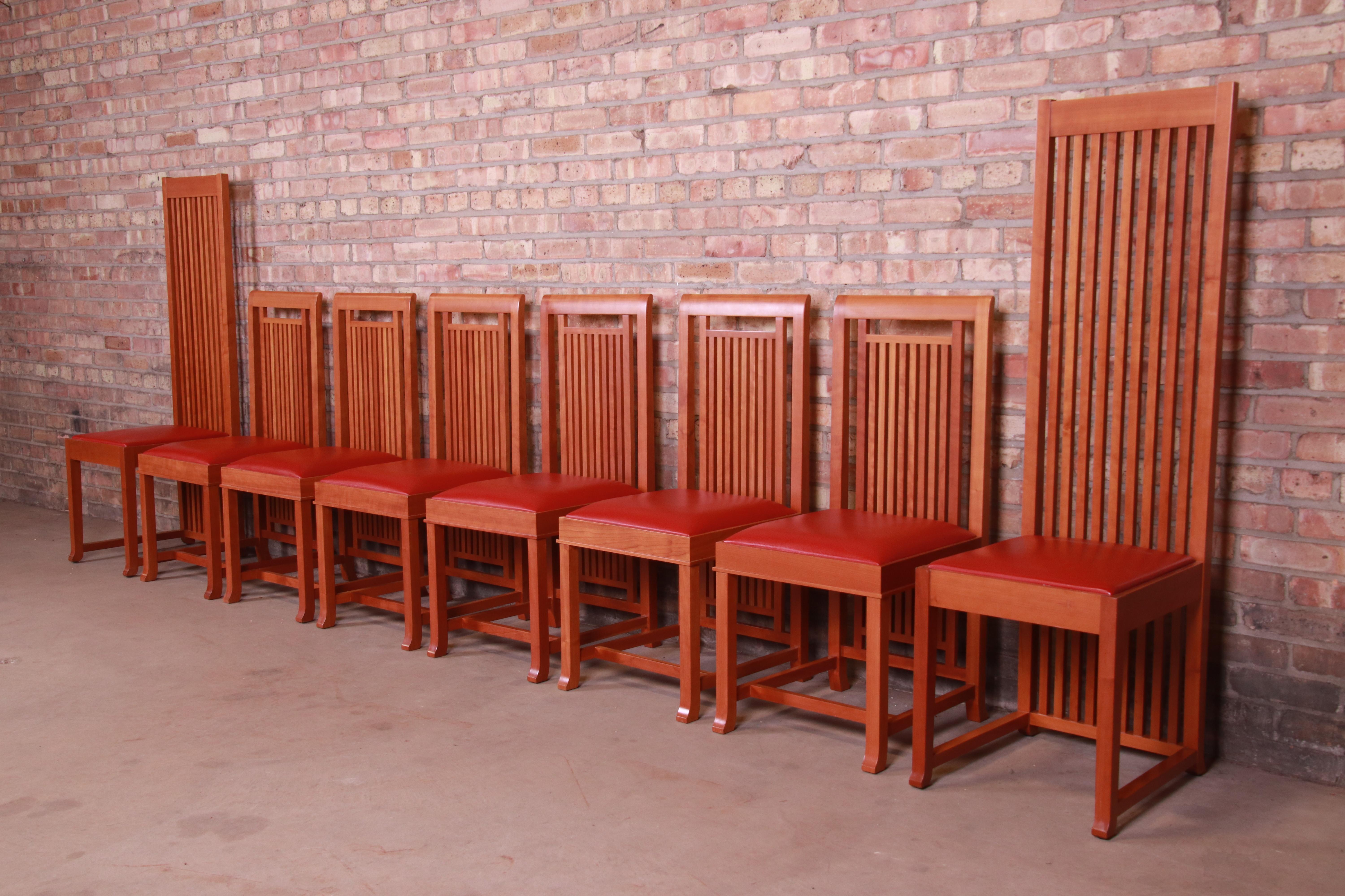 An exceptional set of eight Arts & Crafts style dining chairs, including six iconic 