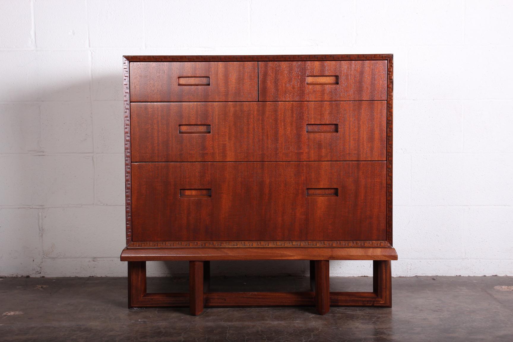 A rare mahogany chest of drawers on stand designed by Frank Lloyd Wright for Henredon.