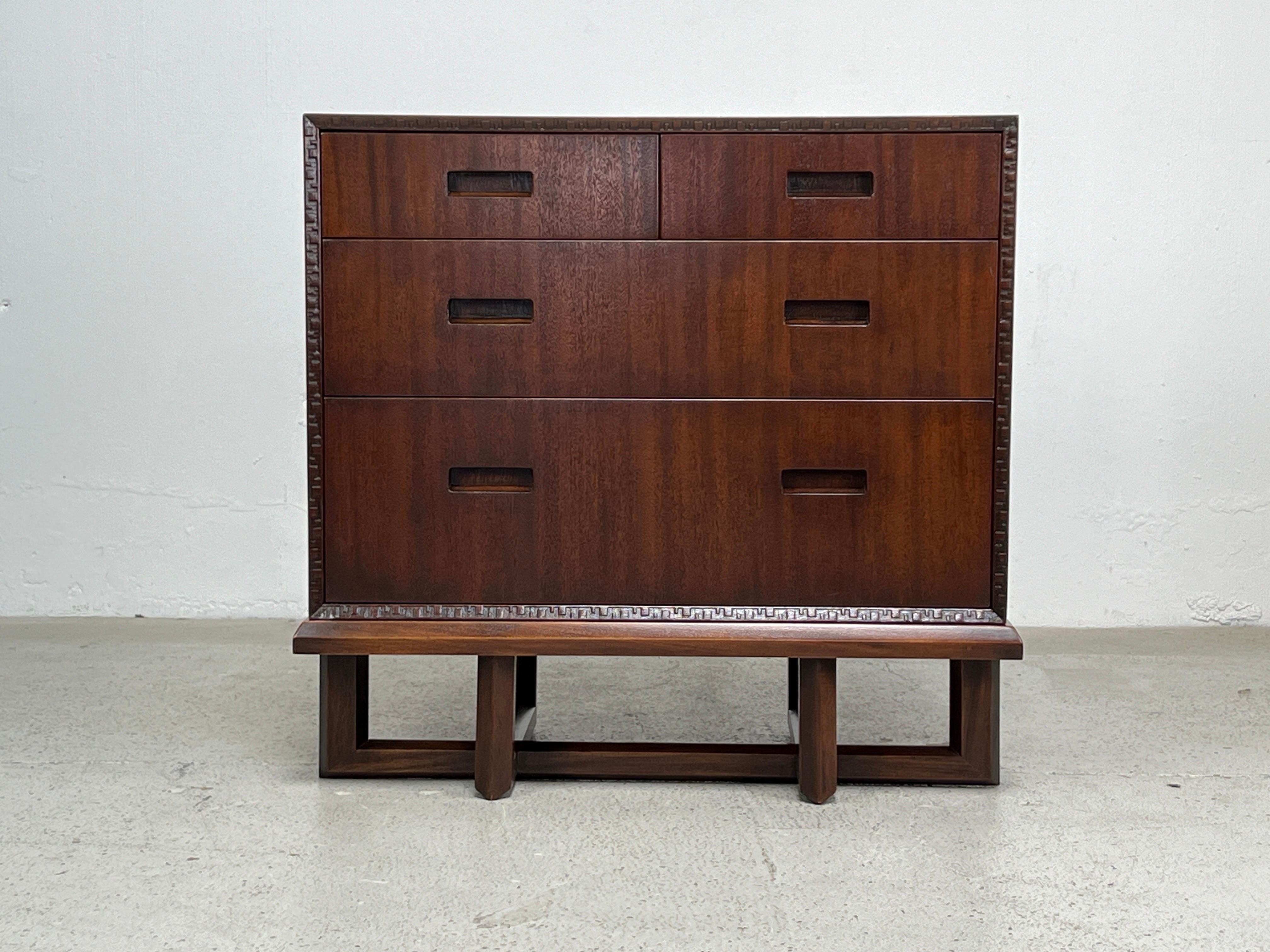A rare mahogany chest of drawers on stand designed by Frank Lloyd Wright for Henredon.