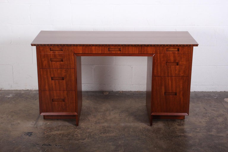 A mahogany desk designed by Frank Lloyd Wright for Henredon.