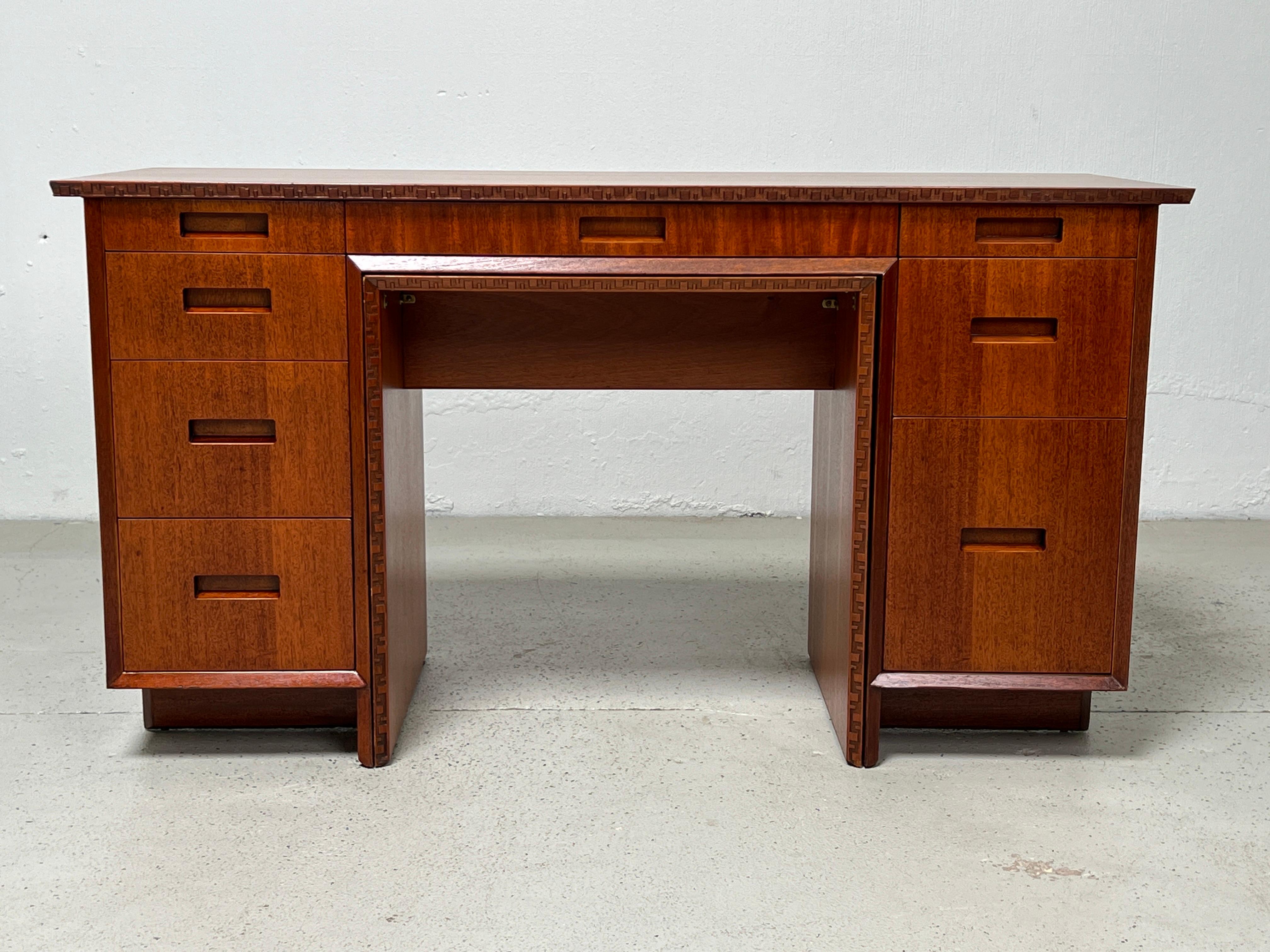 A mahogany desk with pull out 