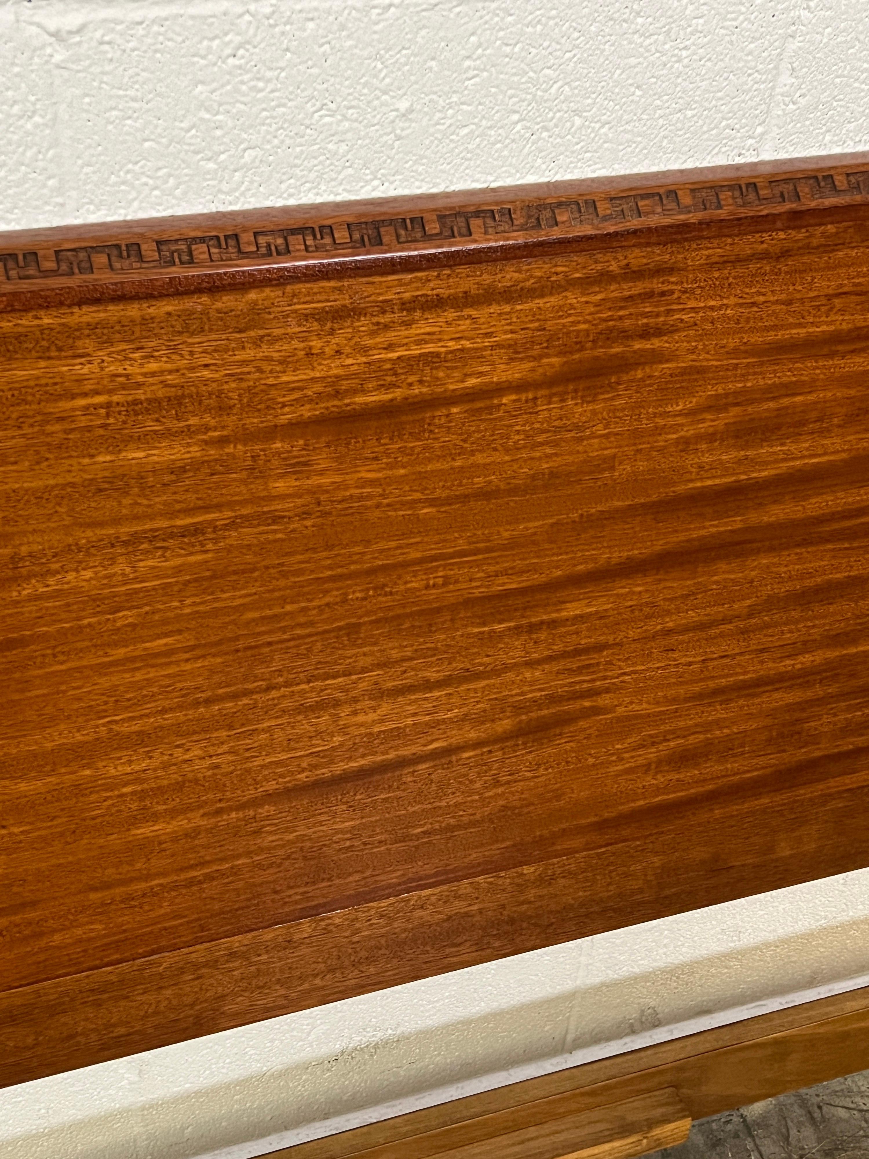 A mahogany kingsize headboard designed by Frank Lloyd Wright for Henredon.