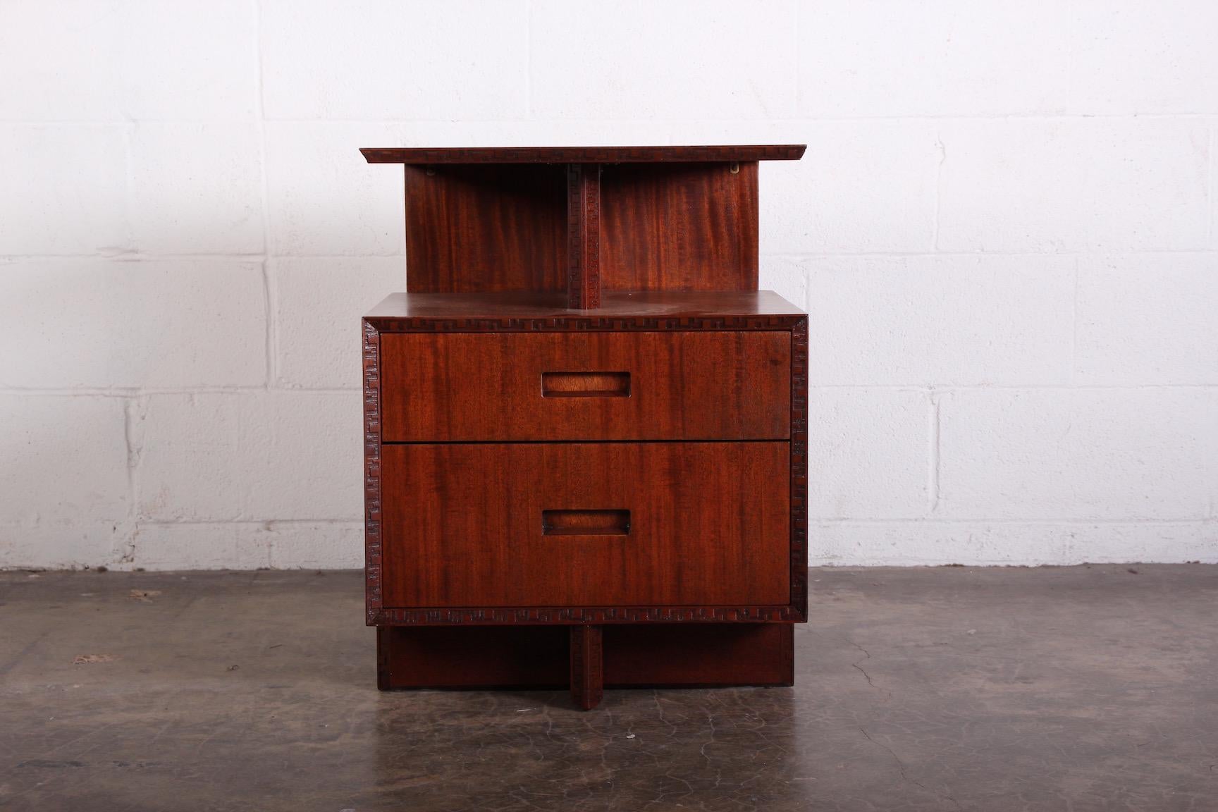 A mahogany nightstand designed by Frank Lloyd Wright for Henredon.