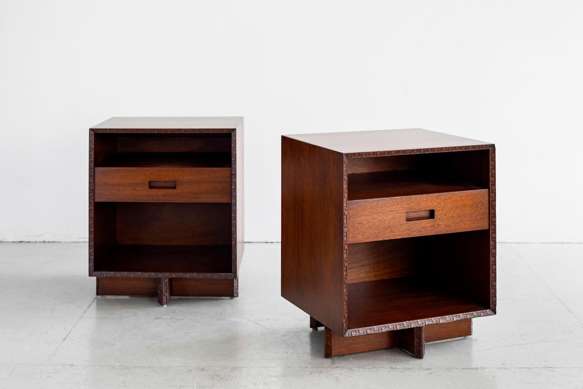 Pair of Frank Lloyd Wright for Henredon nightstands. 
One drawer and open shelf on floating cross base.
Classic and timeless design.
    