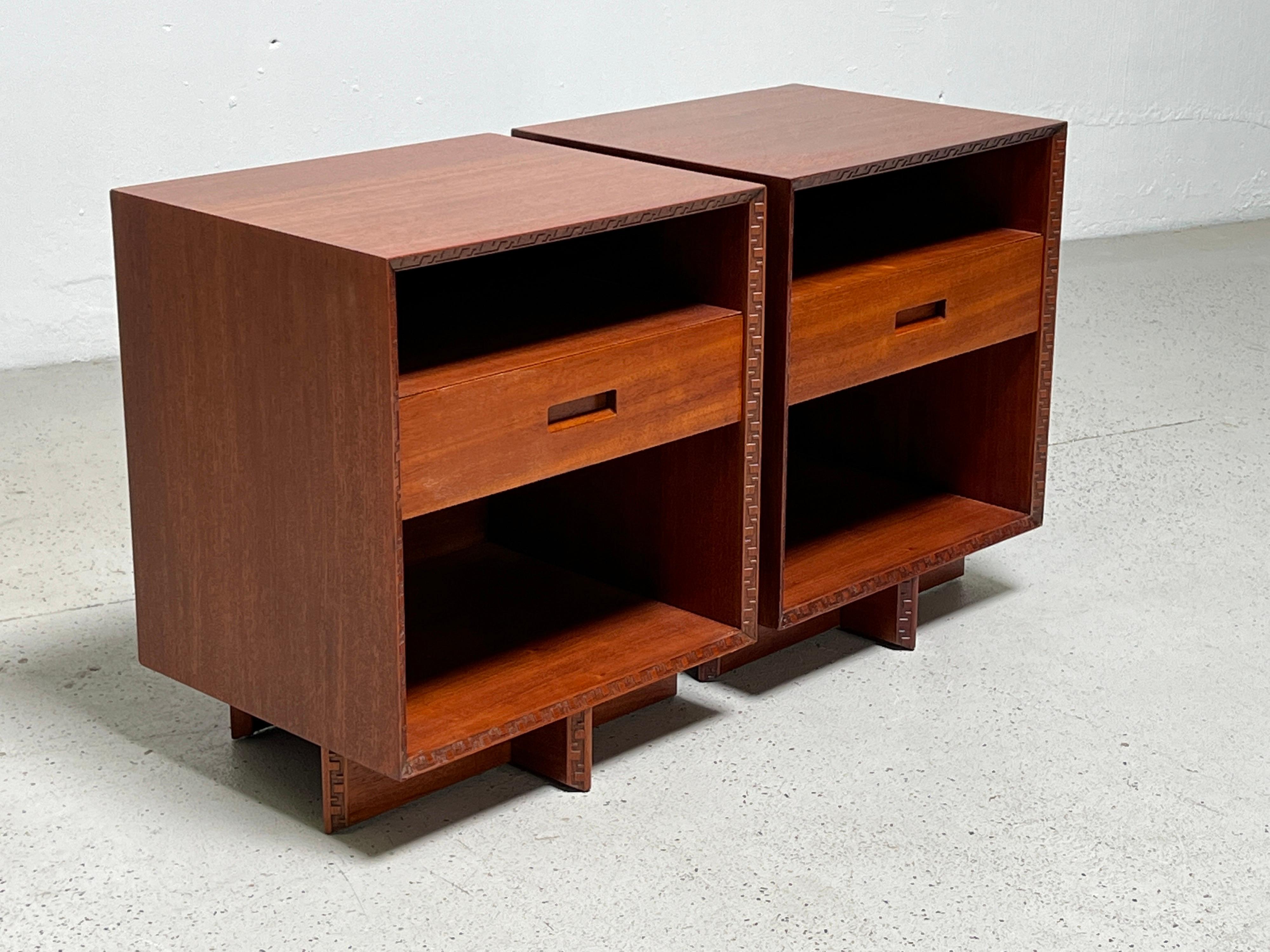 A pair of mahogany bedside tables designed by Frank Lloyd Wright for Henredon.