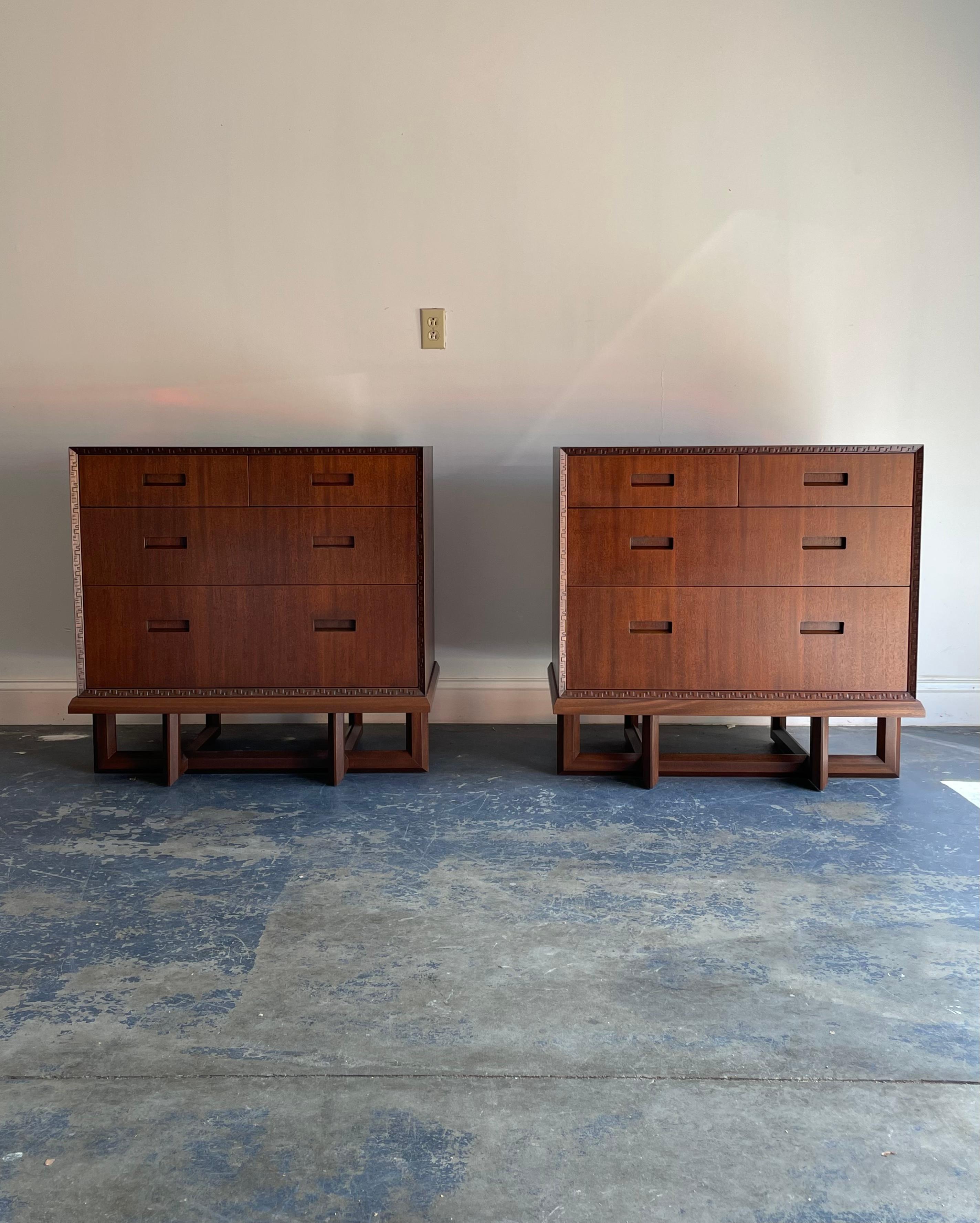 A pair of chests designed by Frank Lloyd Wright for Heritage Henredon with “Taliesin” bordering. Rare chests with architectural base. Each cabinet consisting of four drawers. Please note each chest sits on top of the base and is not
