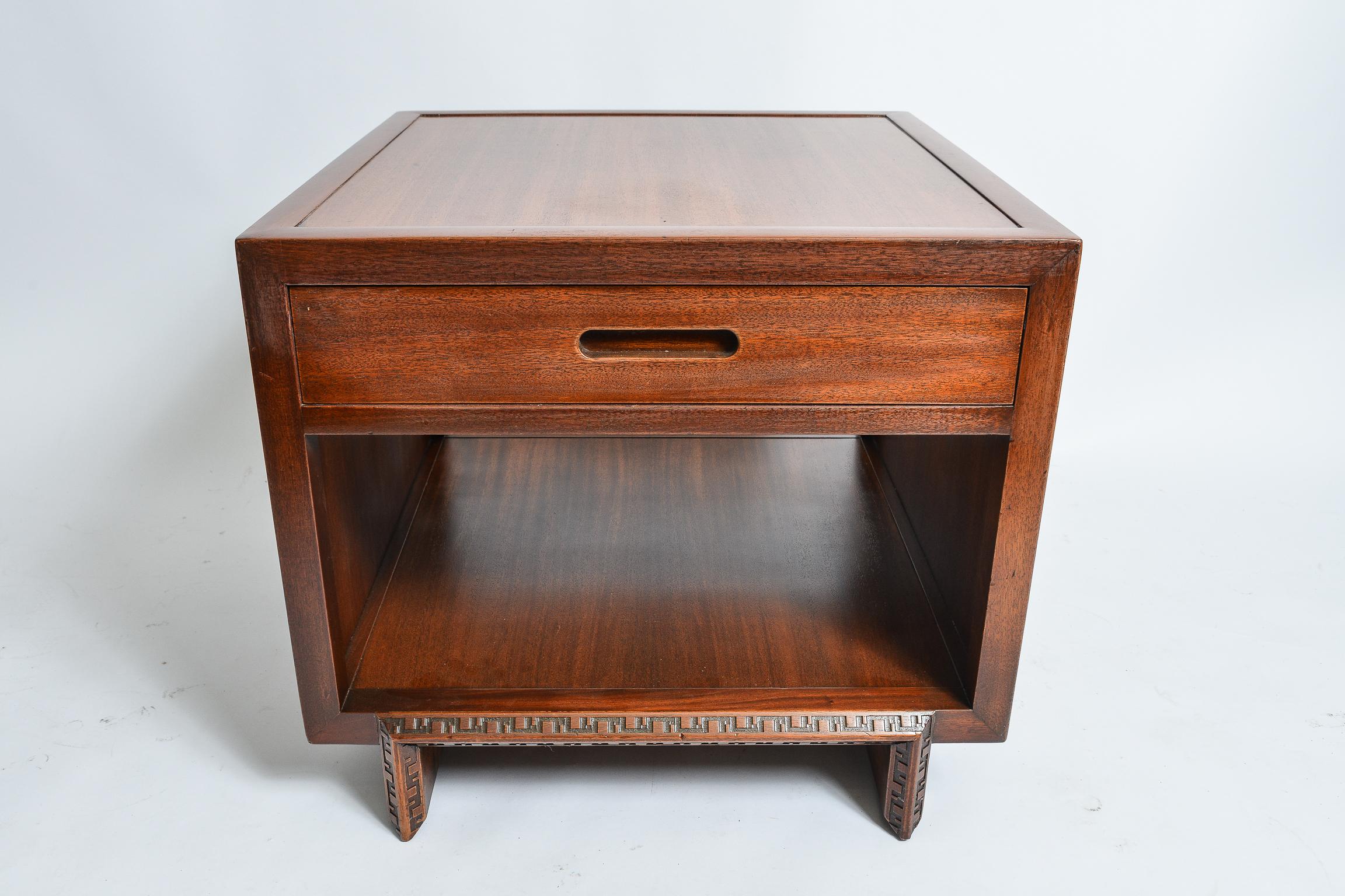 A matched pair of Frank Lloyd Wright single drawer Night Tables
Executed in Mahogany accented by a banded , carved Taliesin border
Henredon stamped mark inside drawers
Refinished
These are the largest version of the cabinets