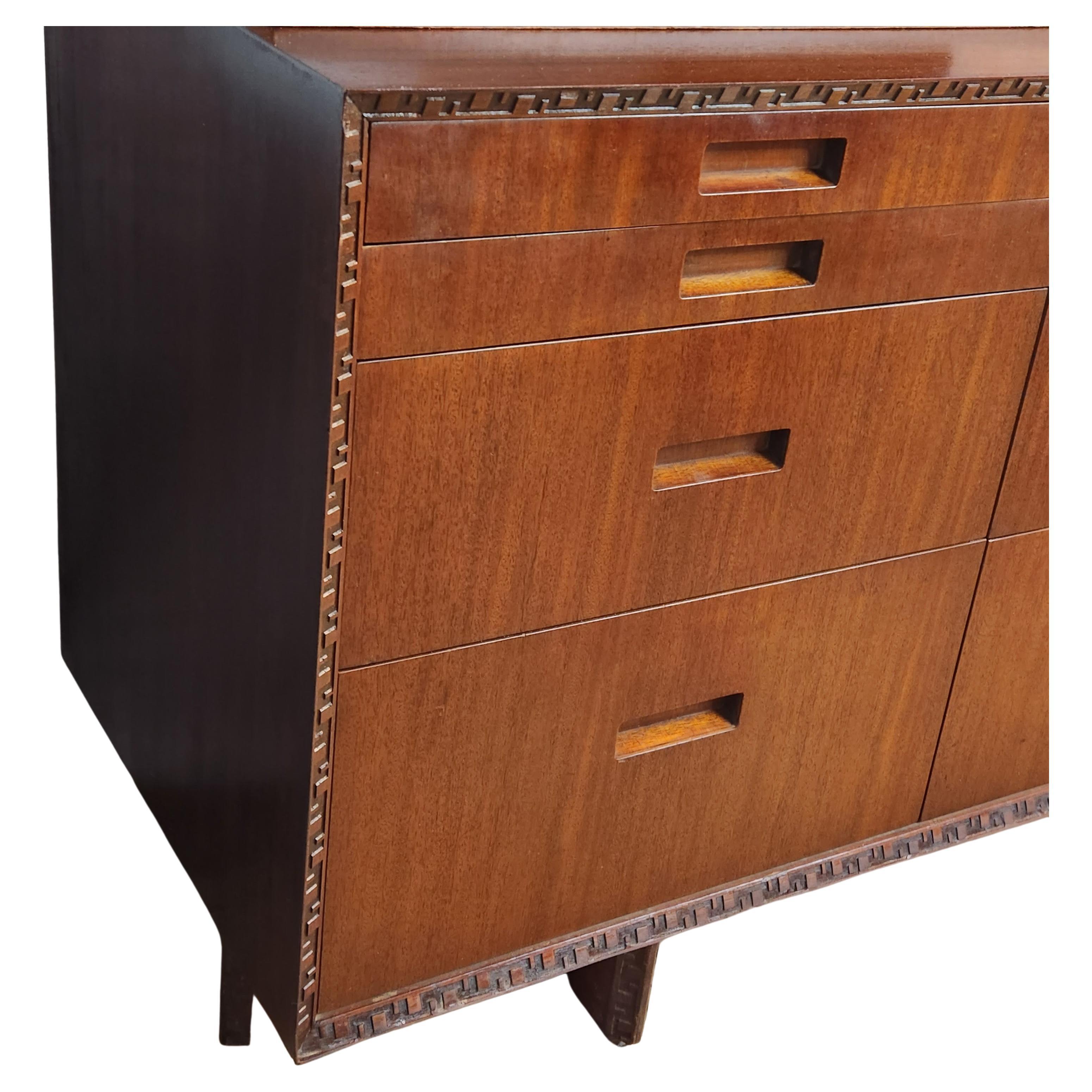 A Honduran Mahogany 11 drawer dresser by Frank Lloyd Wright for Heritage Henredon, part of his Taliesin line.
Signed Frank Lloyd Wright and stamped Heritage Henredon on the inside of a drawer.
This is the only line of furniture that bears his