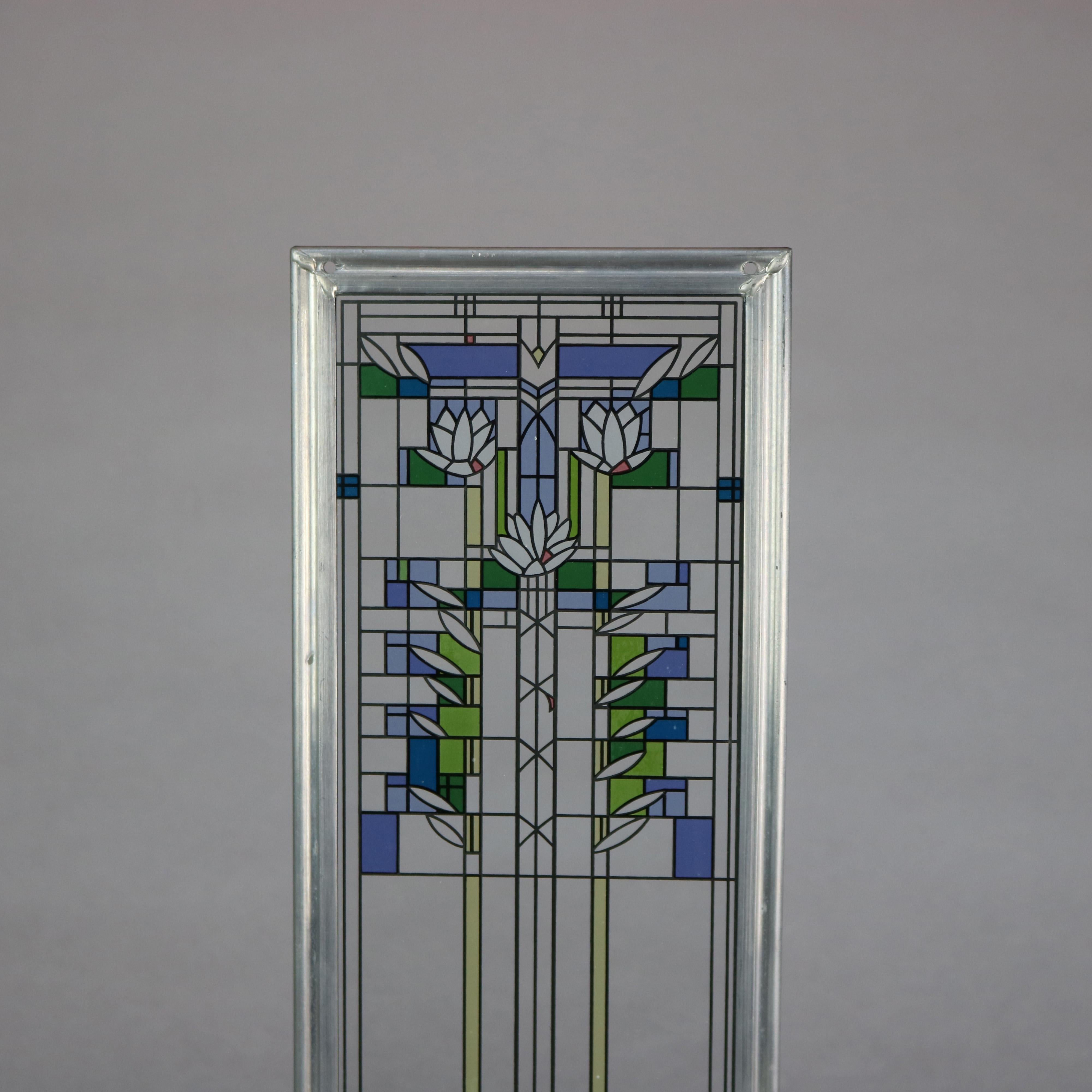 Frank Lloyd Wright Foundation (FLLW Fdn.) Prairie School glass panel depicts enameled replica of Avery Coonley Playhouse glass panel, seated in aluminum frame with identifying label as photographed, 20th century

Measures: 17.5