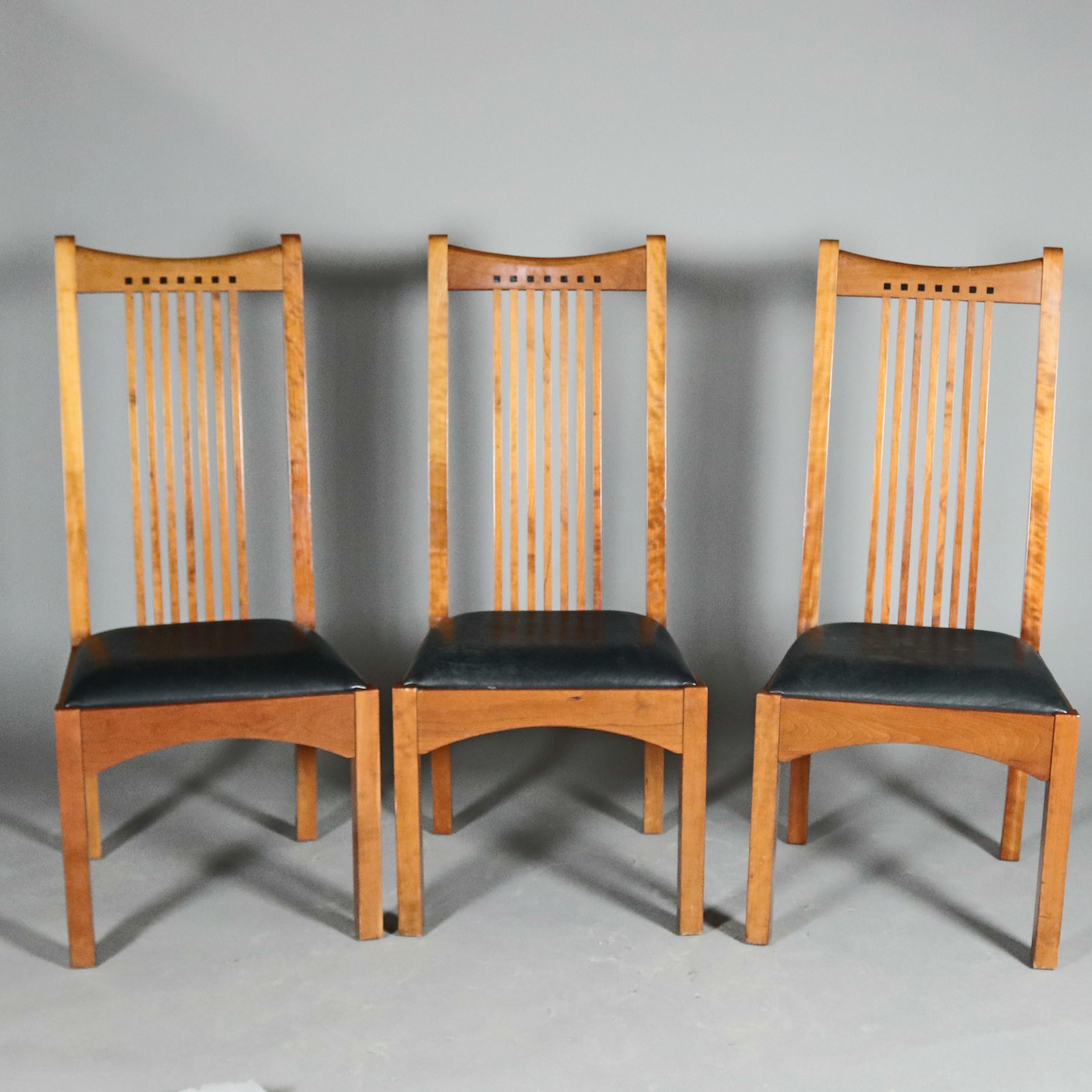 Set of 6 Frank Lloyd Wright Prairie School Arts & Crafts cherry tall back dining chairs by Stickley each feature slat back with bowed crest having ebonized architectural inlay with upholstered seats with arched skirting raised on straight and square