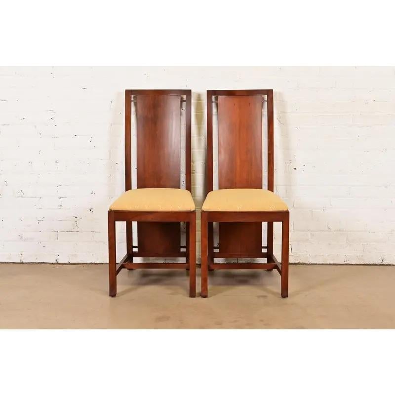 An outstanding pair of Mid-Century Modern or Arts & Crafts style high back side chairs or dining chairs

Designed by Frank Lloyd Wright and produced by Copeland Furniture

USA, Early 21st Century

Measures: 17