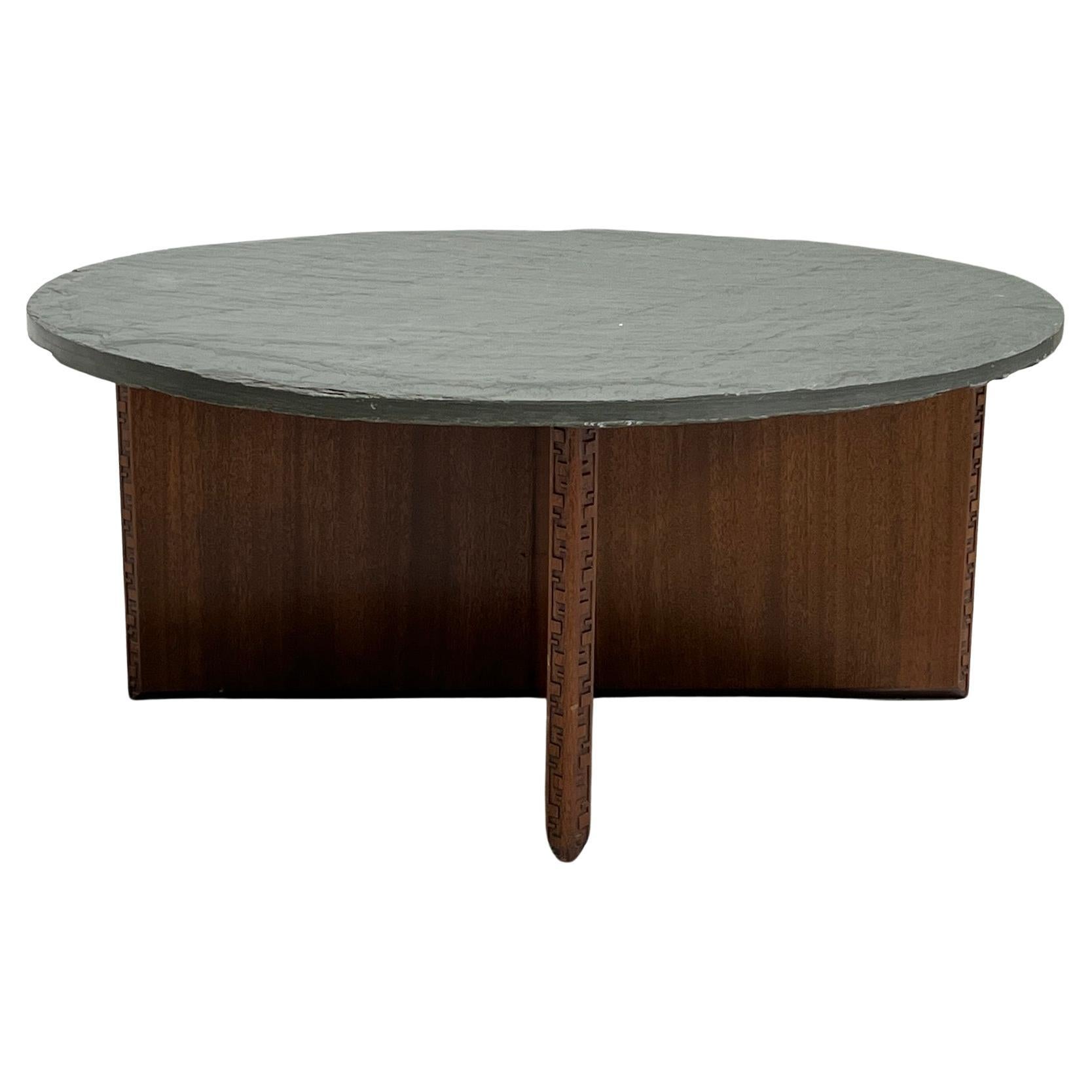 A Frank Lloyd Wright for Henredon mahogany table with original slate top.