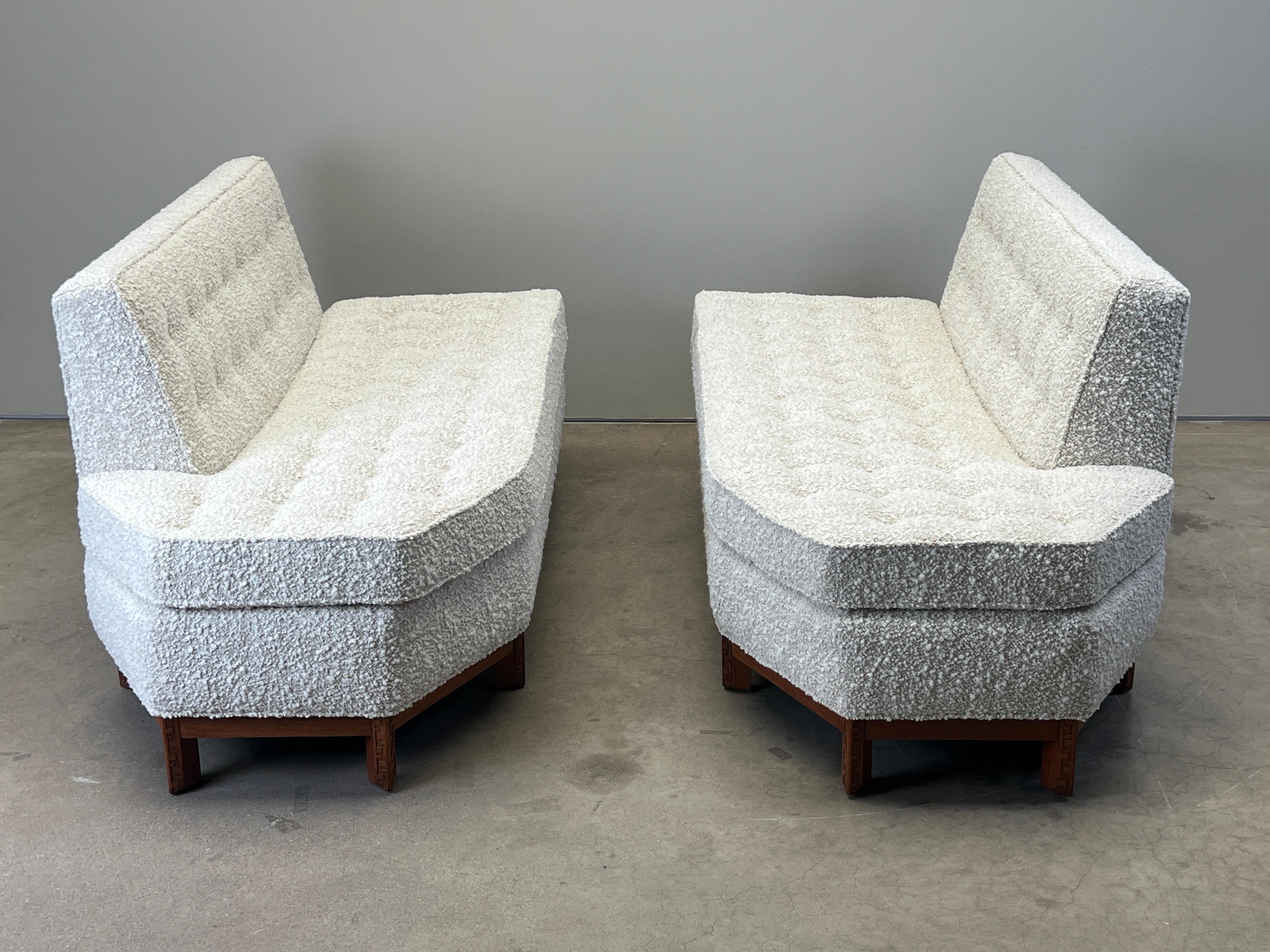 A beautifully restored two piece sofa designed by Frank Lloyd Wright for Henredon. Mahogany frame with Taliesin Greek key detail.  Reupholstered in Holly Hunt / Los Cabos / Daybreak fabric. 