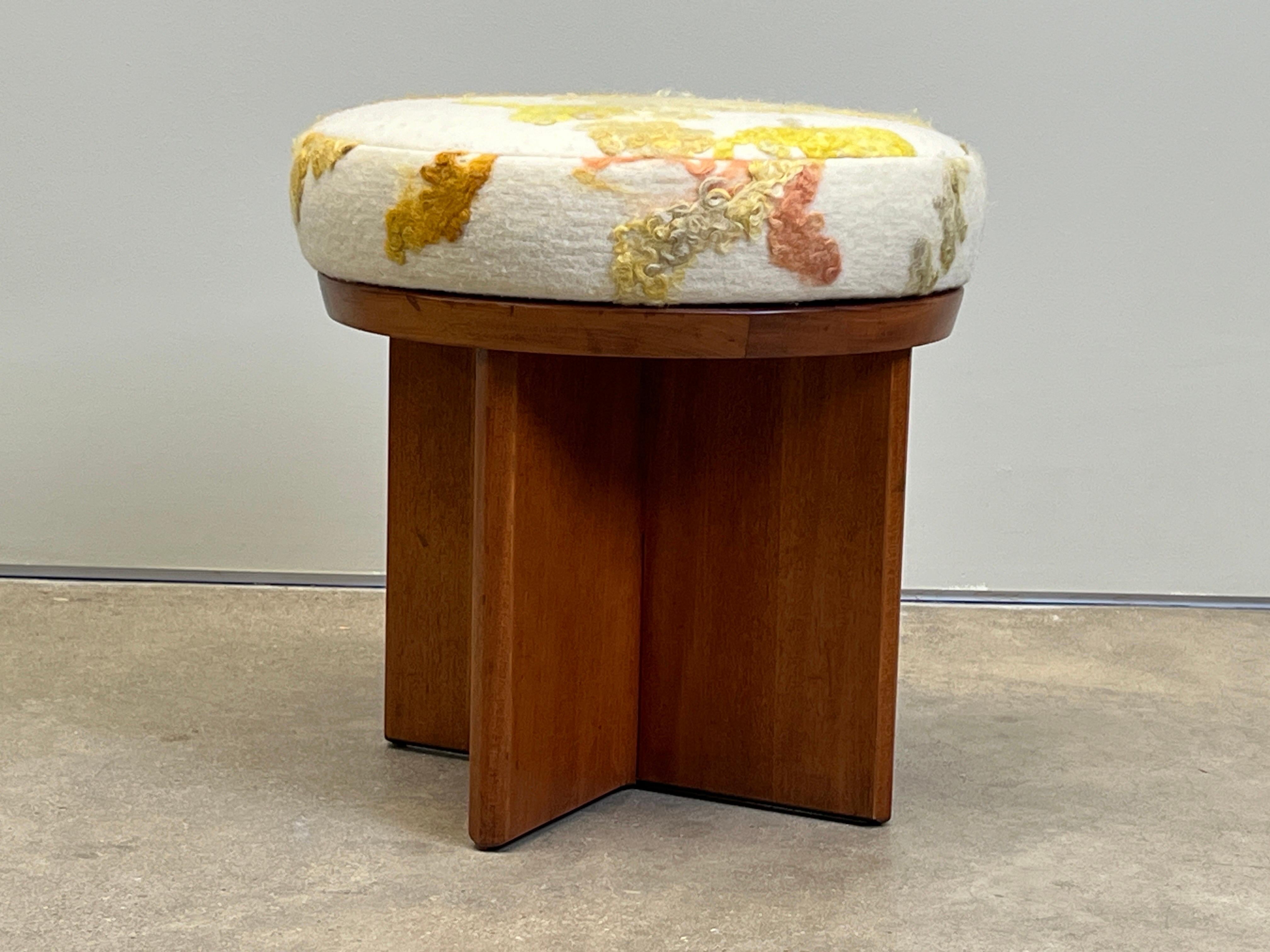 A rotating stool designed by Frank Lloyd Wright for Henredon upholstered in a custom felted wool. 