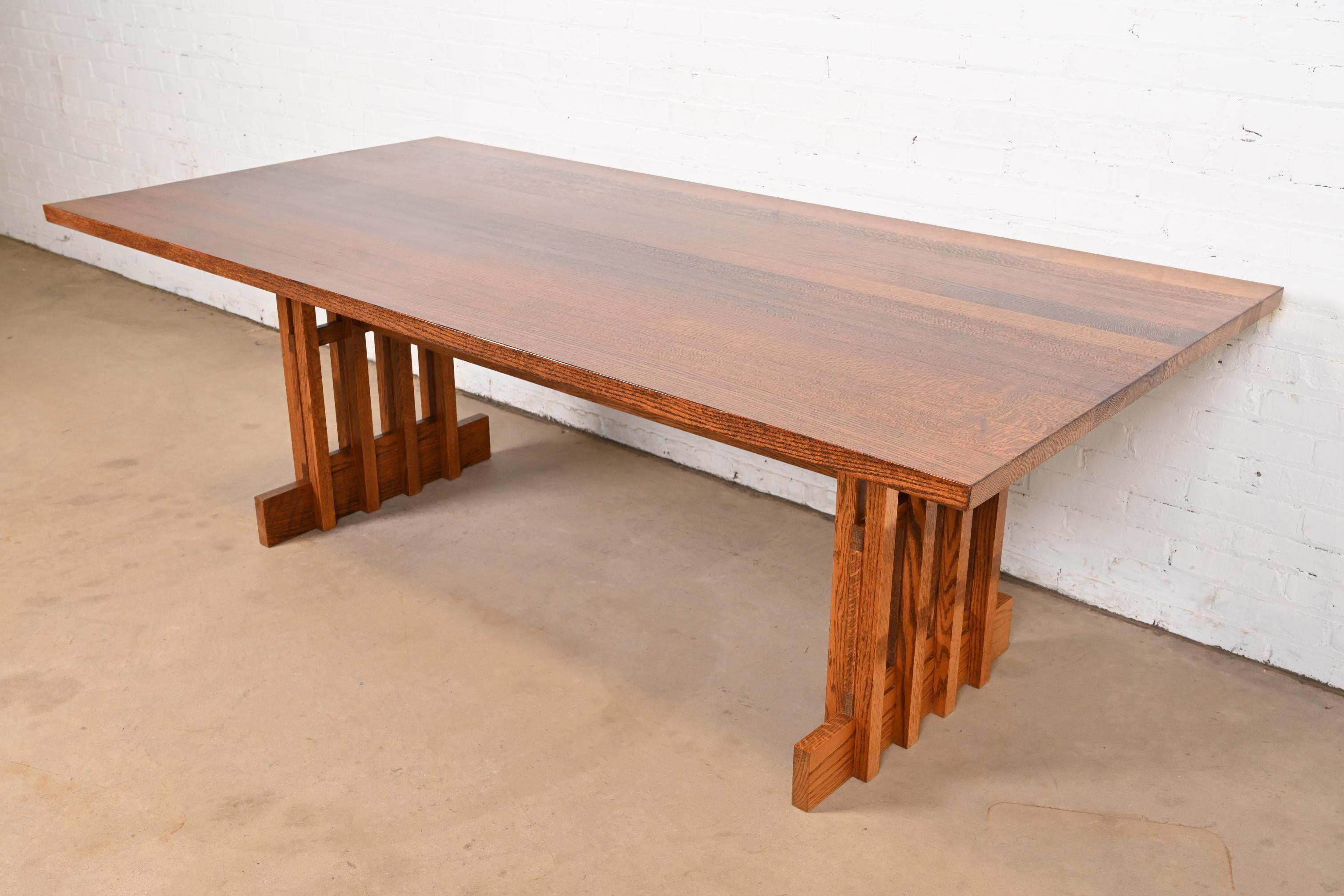 An exceptional Mission or Arts & Crafts solid oak trestle dining table

In the manner of L. & J.G. Stickley

USA, Circa Early 21st Century

Measures: 83.63
