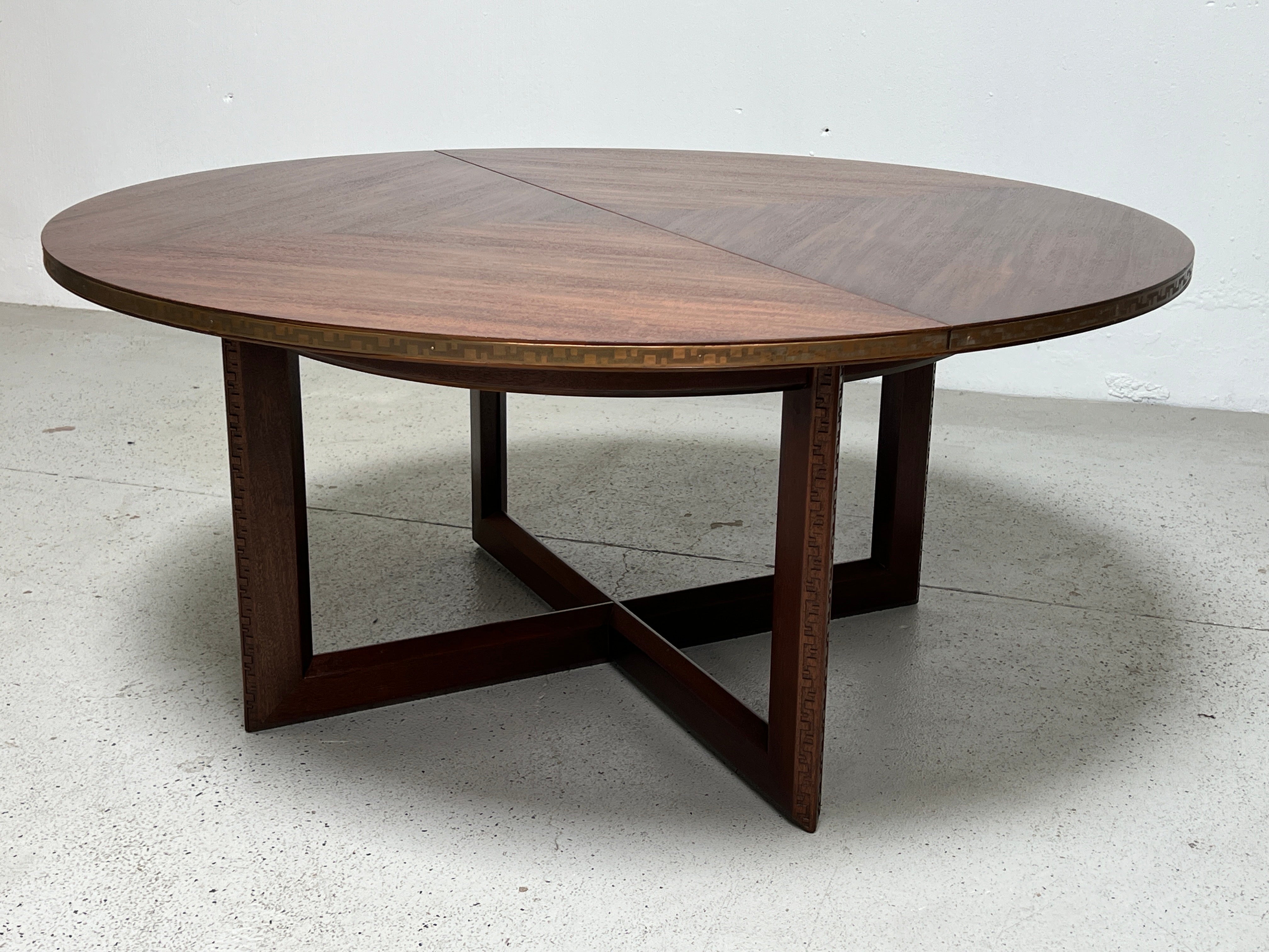 Frank Lloyd Wright for Heritage Henredon. Taliesin dining or game table. Mahogany table, concentric square pattern bookmatched with embossed copper 