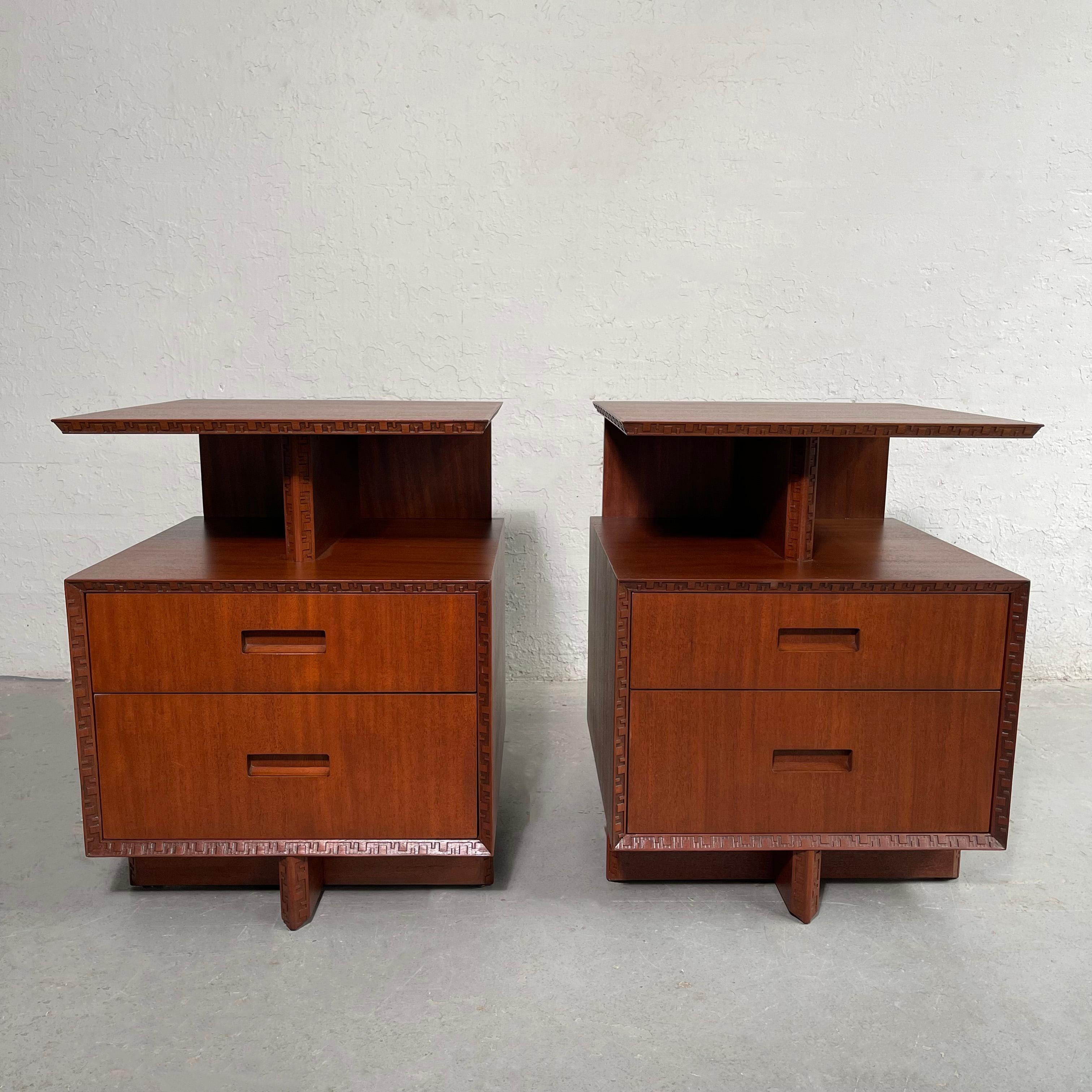 Pair of outstanding, Taliesin Group, tiered mahogany end tables, nightstands by Frank Lloyd Wright for Heritage-Henredon feature a bottom level with two drawers at 18 inches height and a top tier with shelf space below trimmed in the signature
