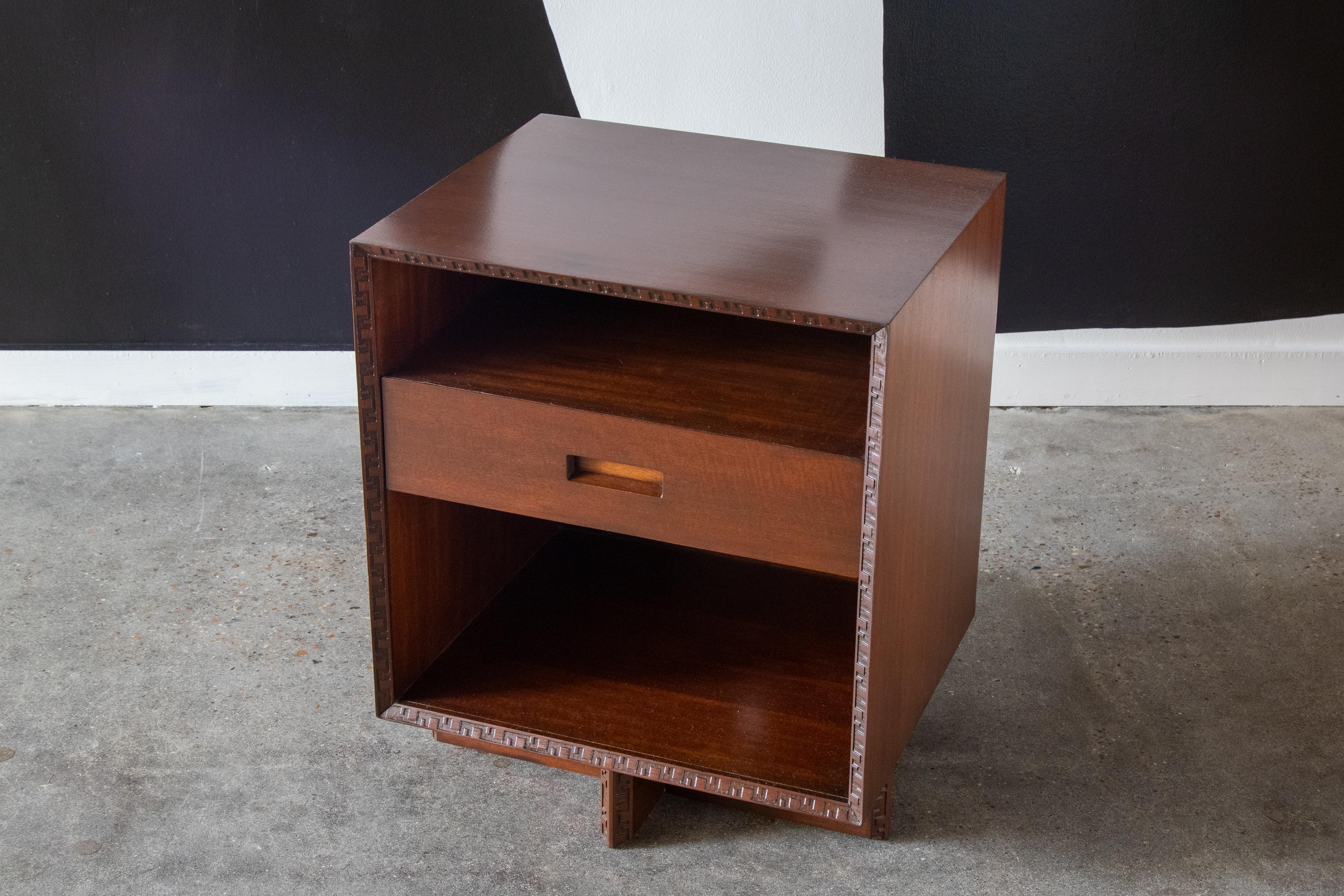 A nightstand / end table designed by Frank Lloyd Wright for Heritage Henredon as part of the Taliesin line. Great storage drawer with two open cubbies for storing books or other items.

These cabinets are coveted for their great architectural